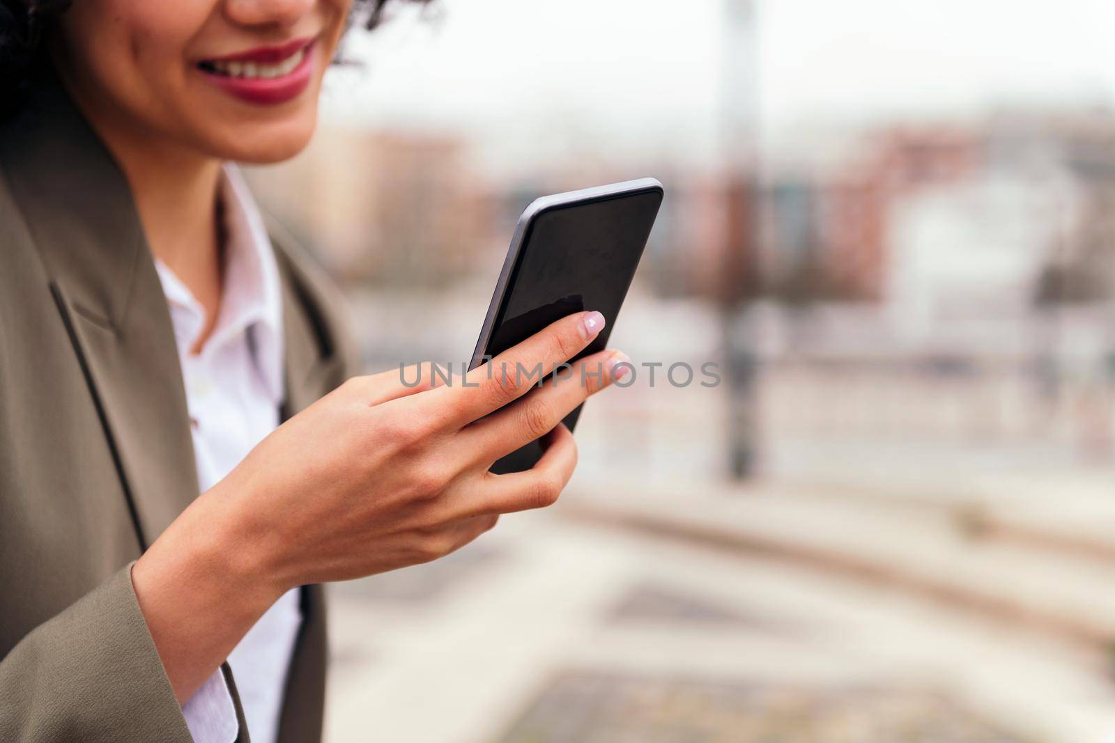 close up of the hand of an unrecognizable young woman holding a smart phone, technology and communication concept, copy space for text