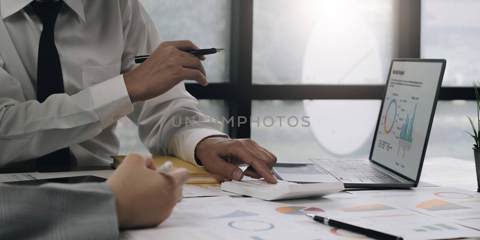 Group of business people brainstorming, analyzing and planning to work together at the meeting..