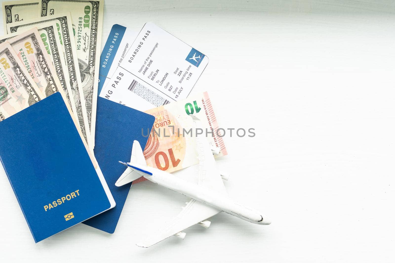 Preparation for Traveling concept, toy airplane, passport with copy space.