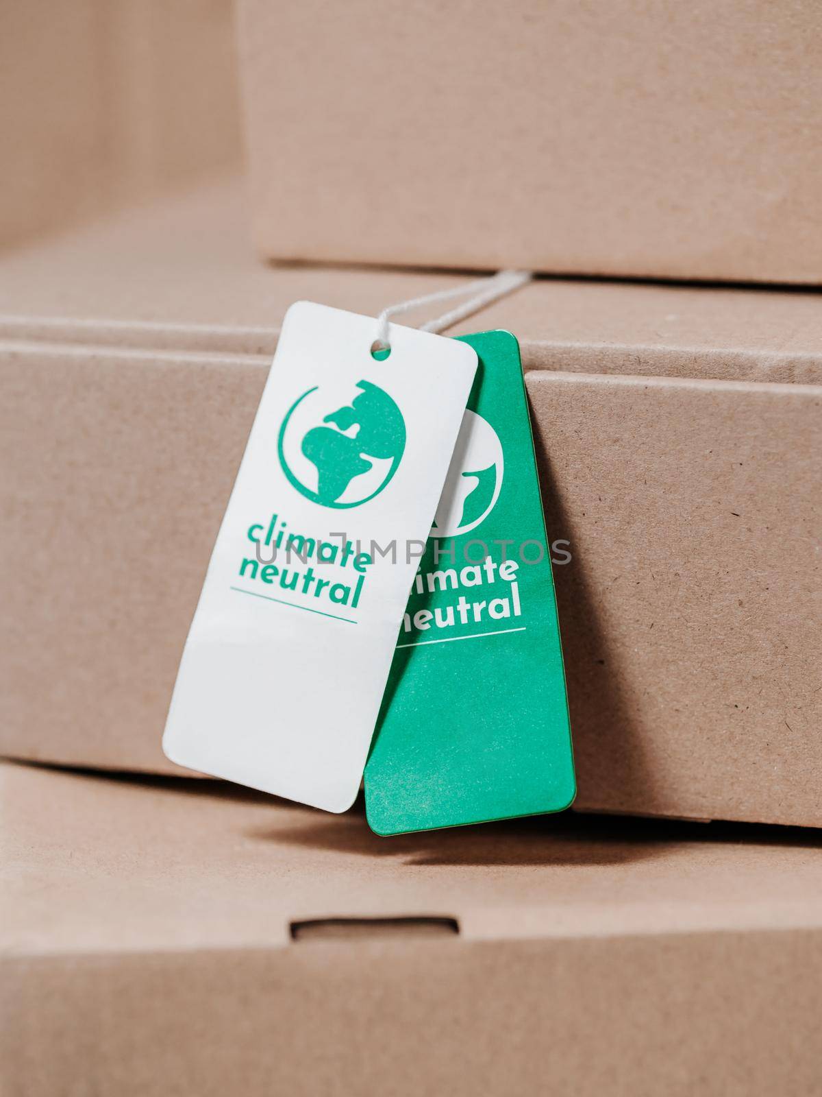 Carbon neutral product in craft boxes, Label Climate neutral. Carbon neutral concept in apparel, fashion, logistics industry. Ethical consumption. Increasing awareness for customers - carbon footpint