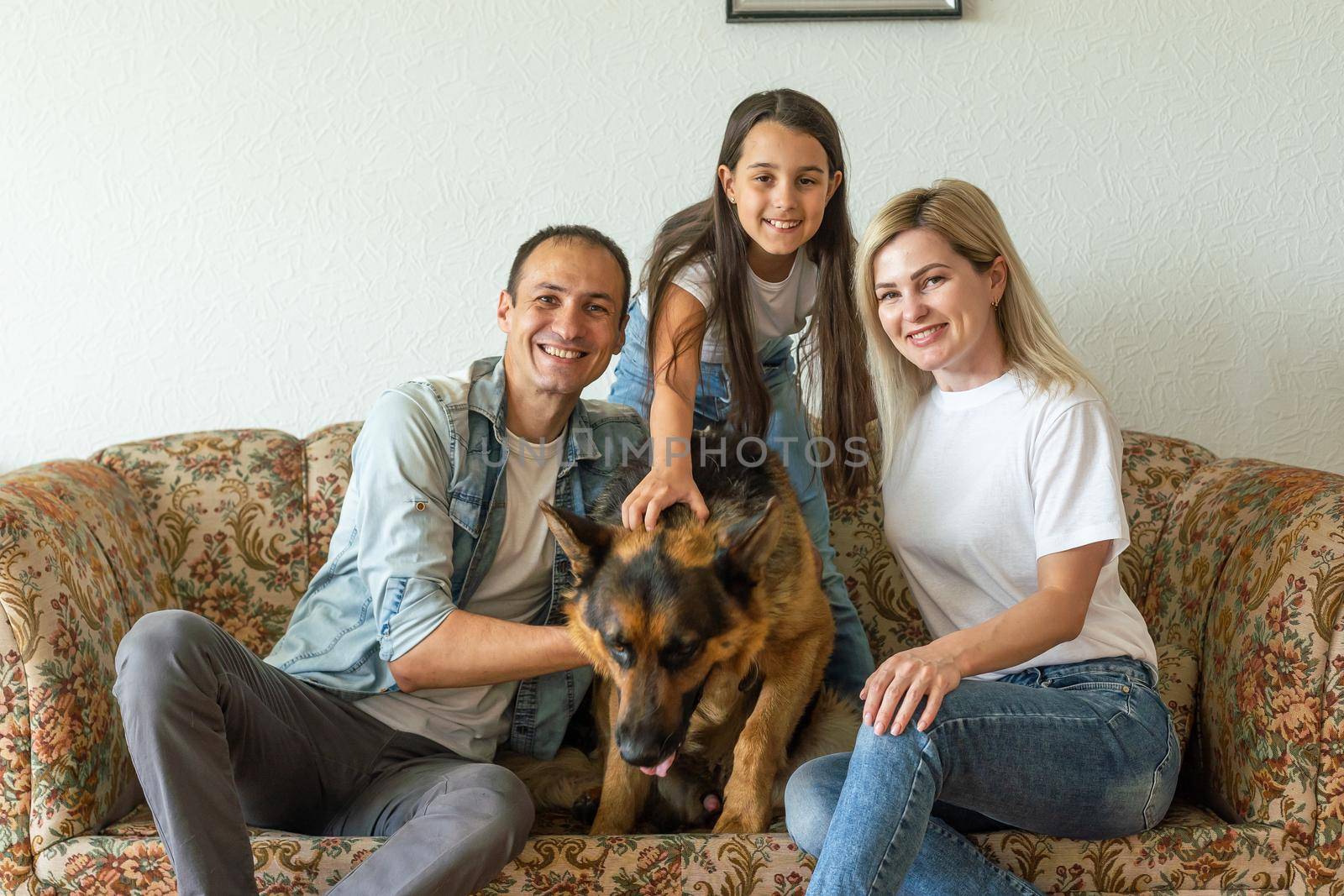 german shepherd and family. German shepherd is the best friend of the child