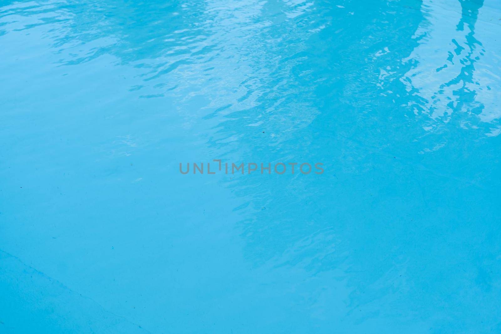 surface of blue swimming pool, background of water in swimming pool. by Andelov13