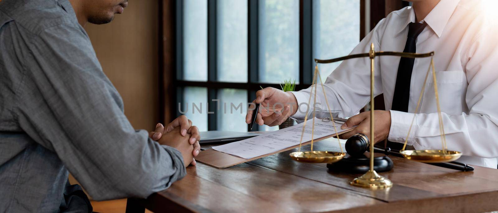 legal consultants, notary or justice lawyer discussing contract document on desk with client customer in courtroom office, business, justice law, insurance, legal service, buy and sell house concept.