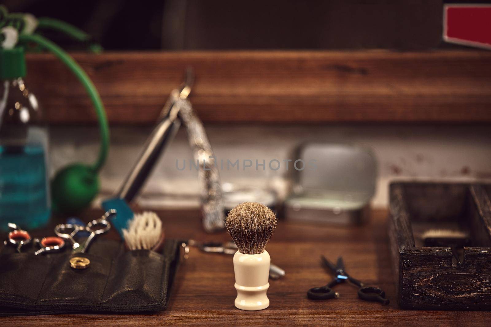 Barbershop tools on wooden brown table. Accessories for shaving and haircuts on the table. Still life