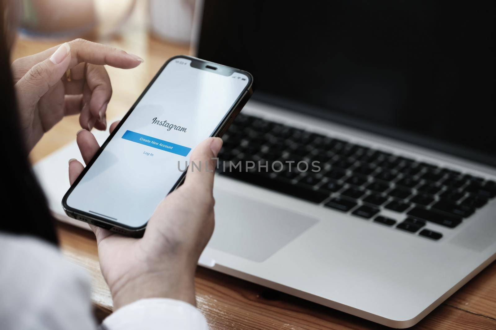 CHIANGMAI, THAILAND - MAY 30, 2021: A woman holding smartphone with Instagram application on the screen. Instagram is a photo sharing app for smartphones. by Manastrong