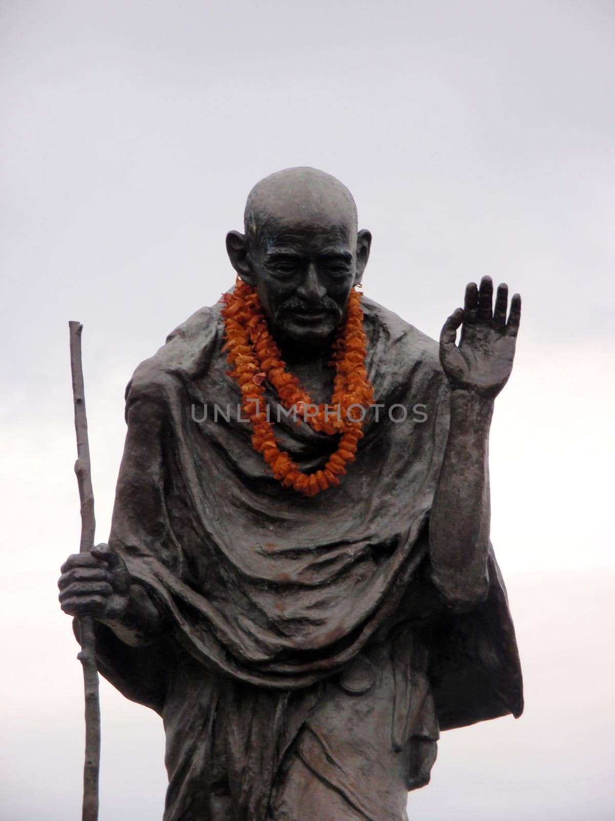 Statue of Ghandi wearing an orange lei in the Embarcadero center, San Francisco, California