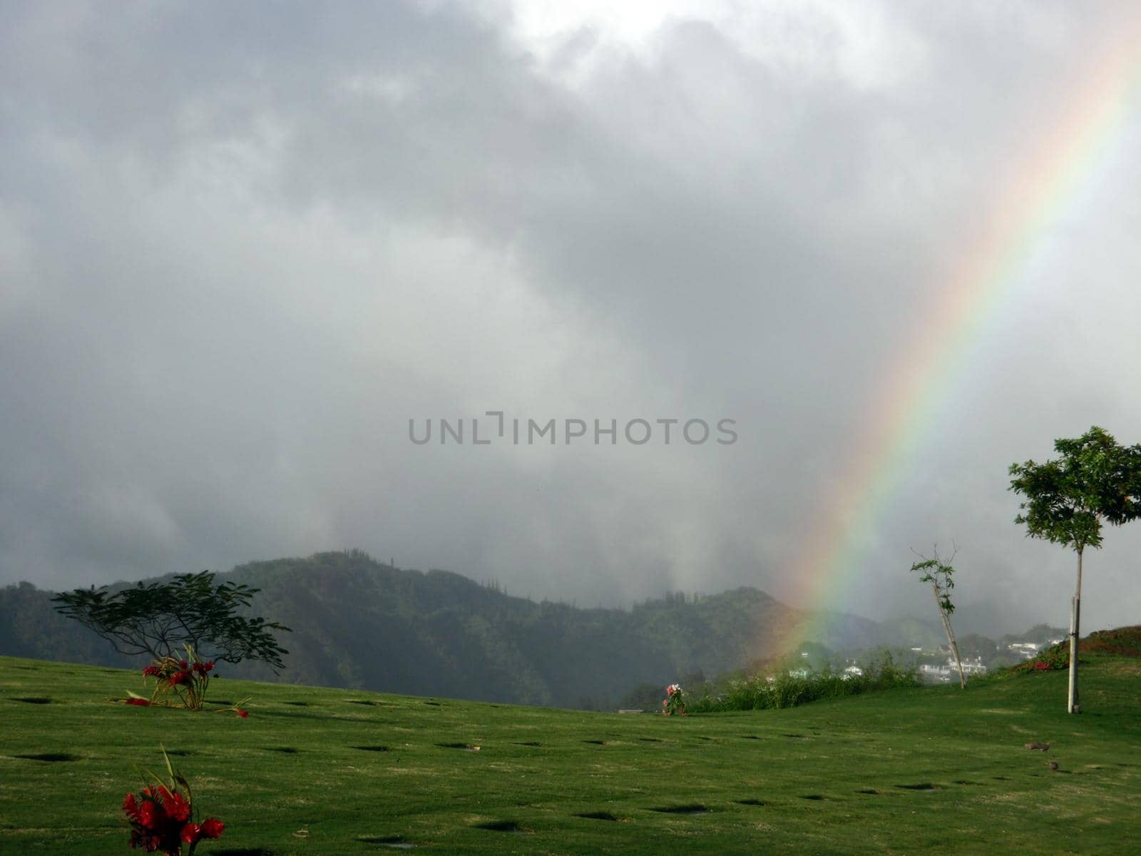 Rainbow over the National Memorial Cemetery of the Pacific in Punchbowl on Oahu, Hawaii.