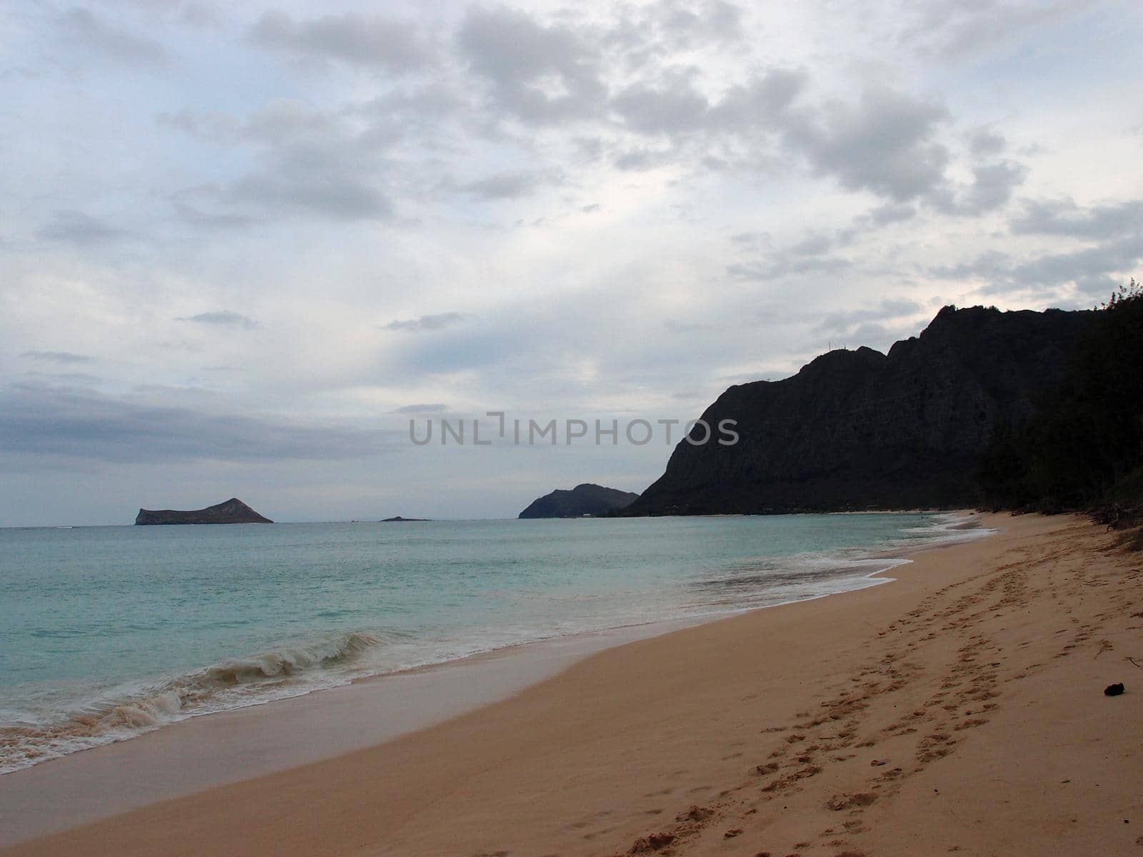 Waimanalo Beach with Rabbit and Rock islands in view at Dusk on Oahu, Hawaii.