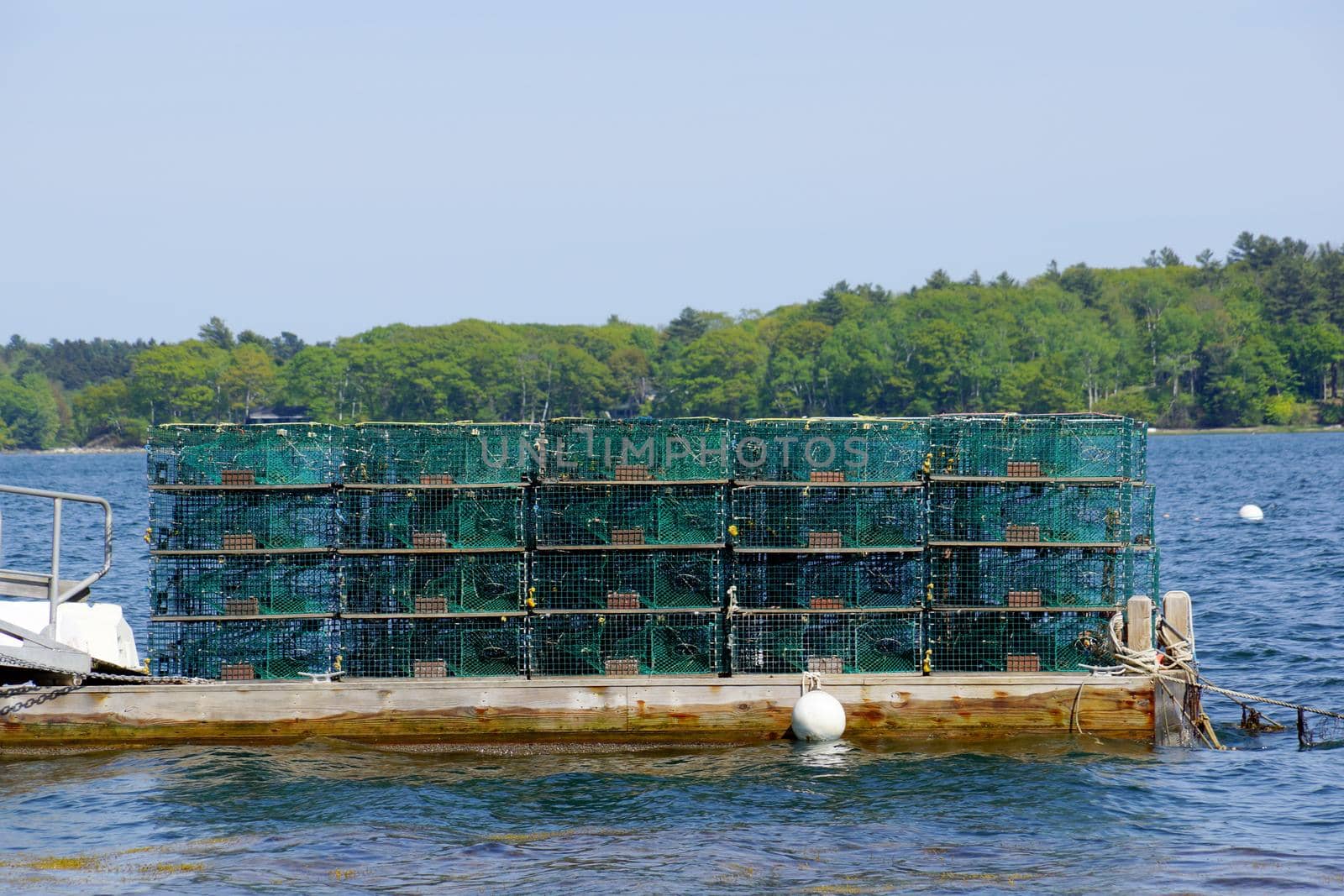 Lobster traps at a fishing pier in coastal Maine, New England  by EricGBVD