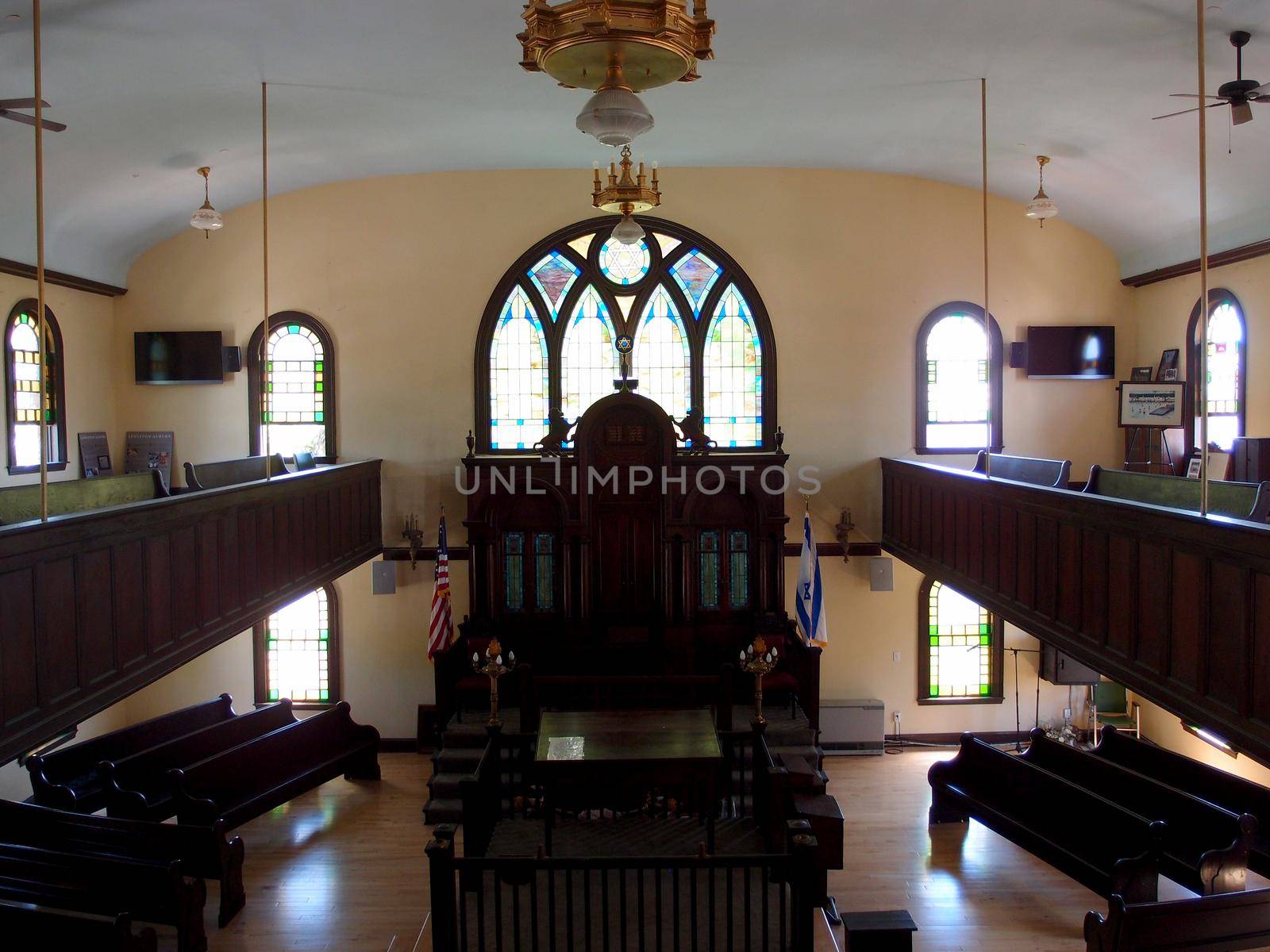 Inside Maine Jewish Museum - Historic Etz Chaim Synagogue built in the 1920's with stain glass shining light into the room.  Portland, Maine.