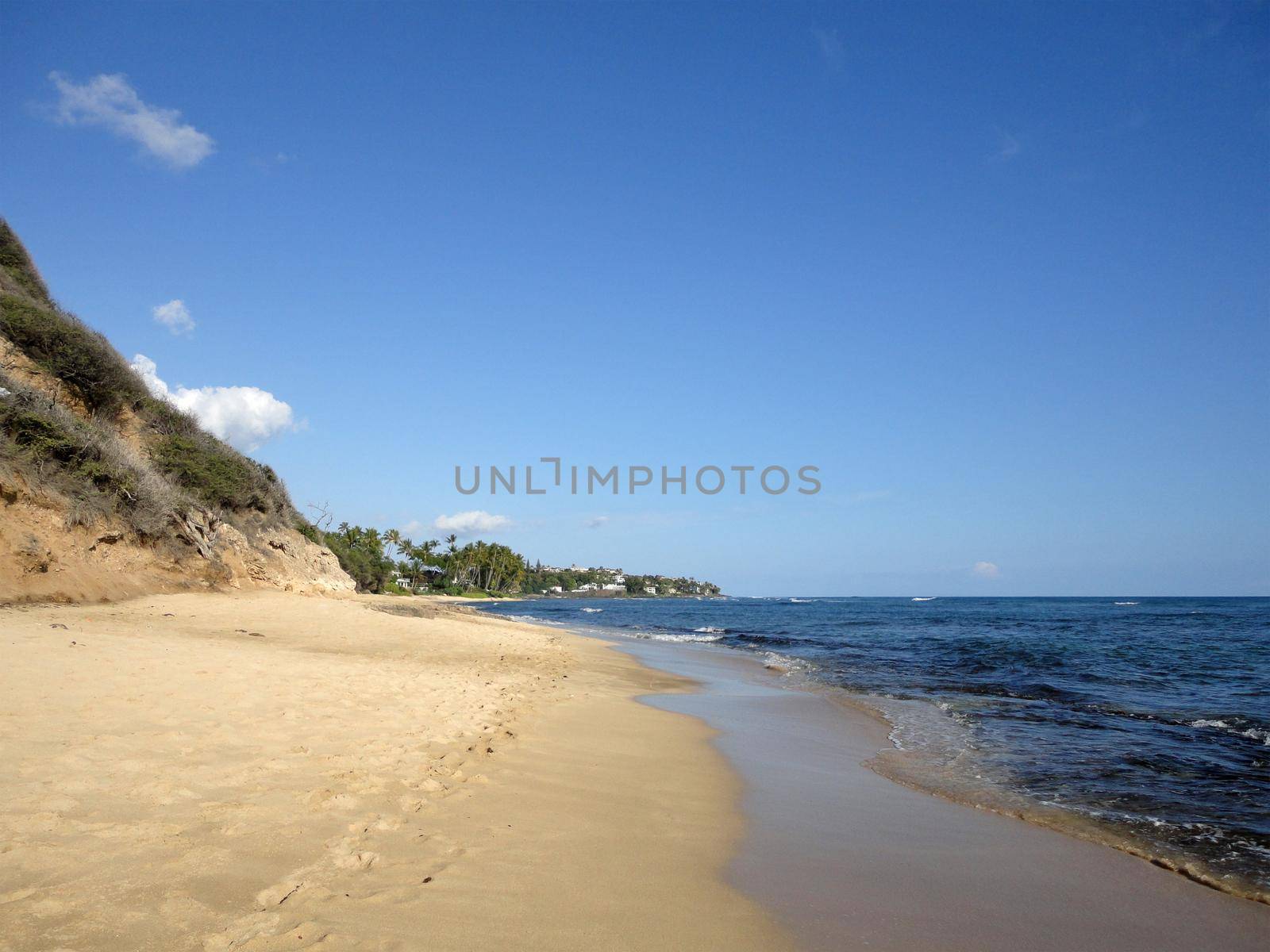 Footprints in the sand on empty Diamond Head Beach by EricGBVD