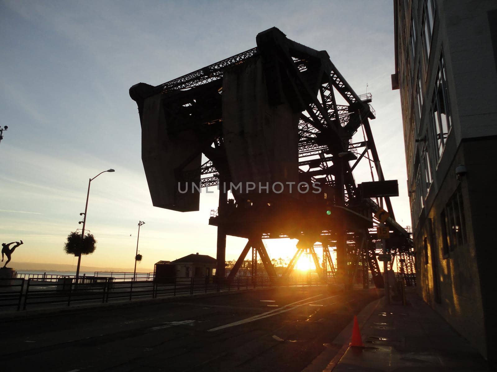 Sunset through historic 3th bridge in San Francisco by EricGBVD