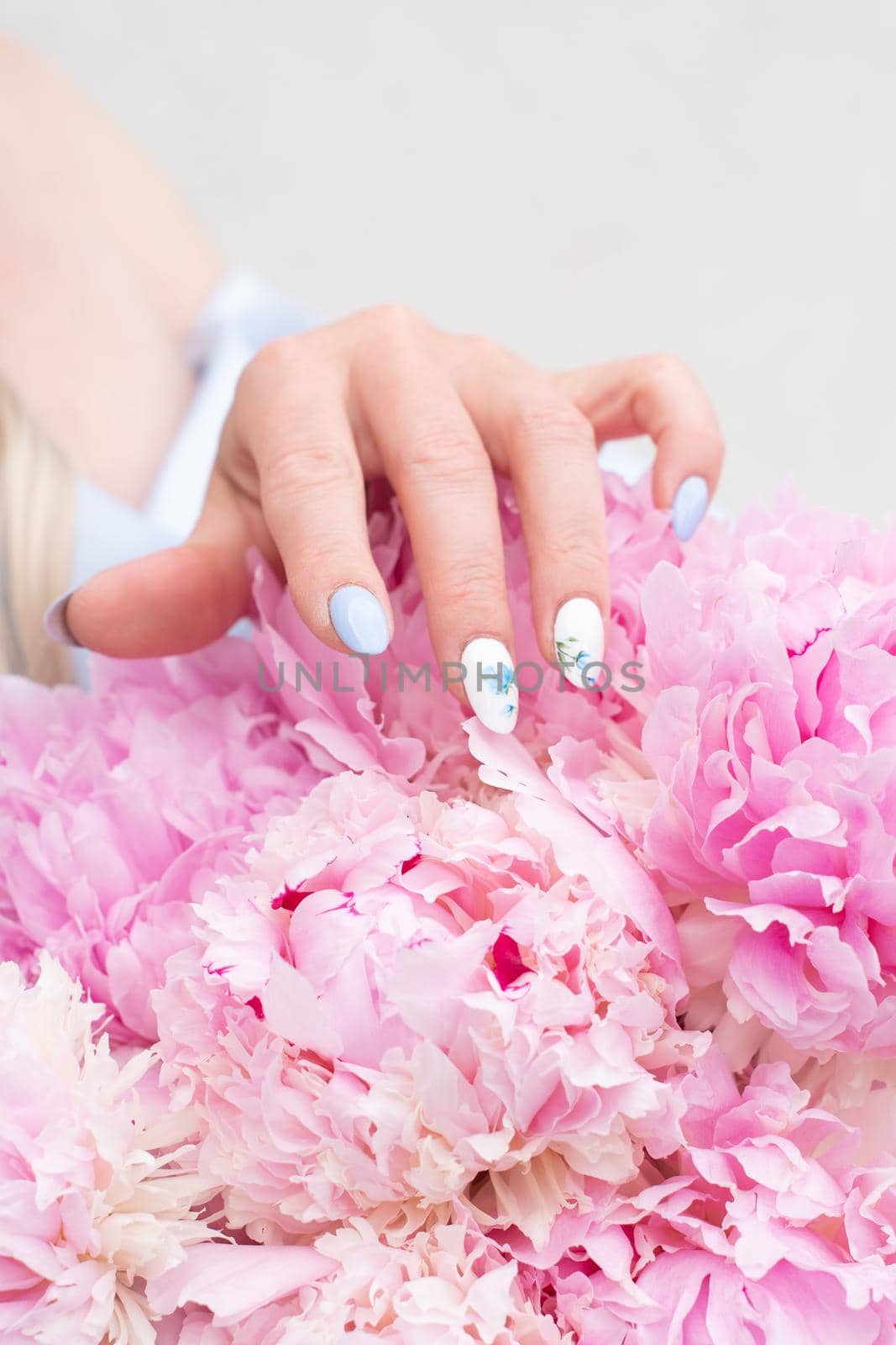 bride in a blue wedding dress with a bouquet of pink peonies, pastel paradise, floral background, complementary color combination. High quality photo