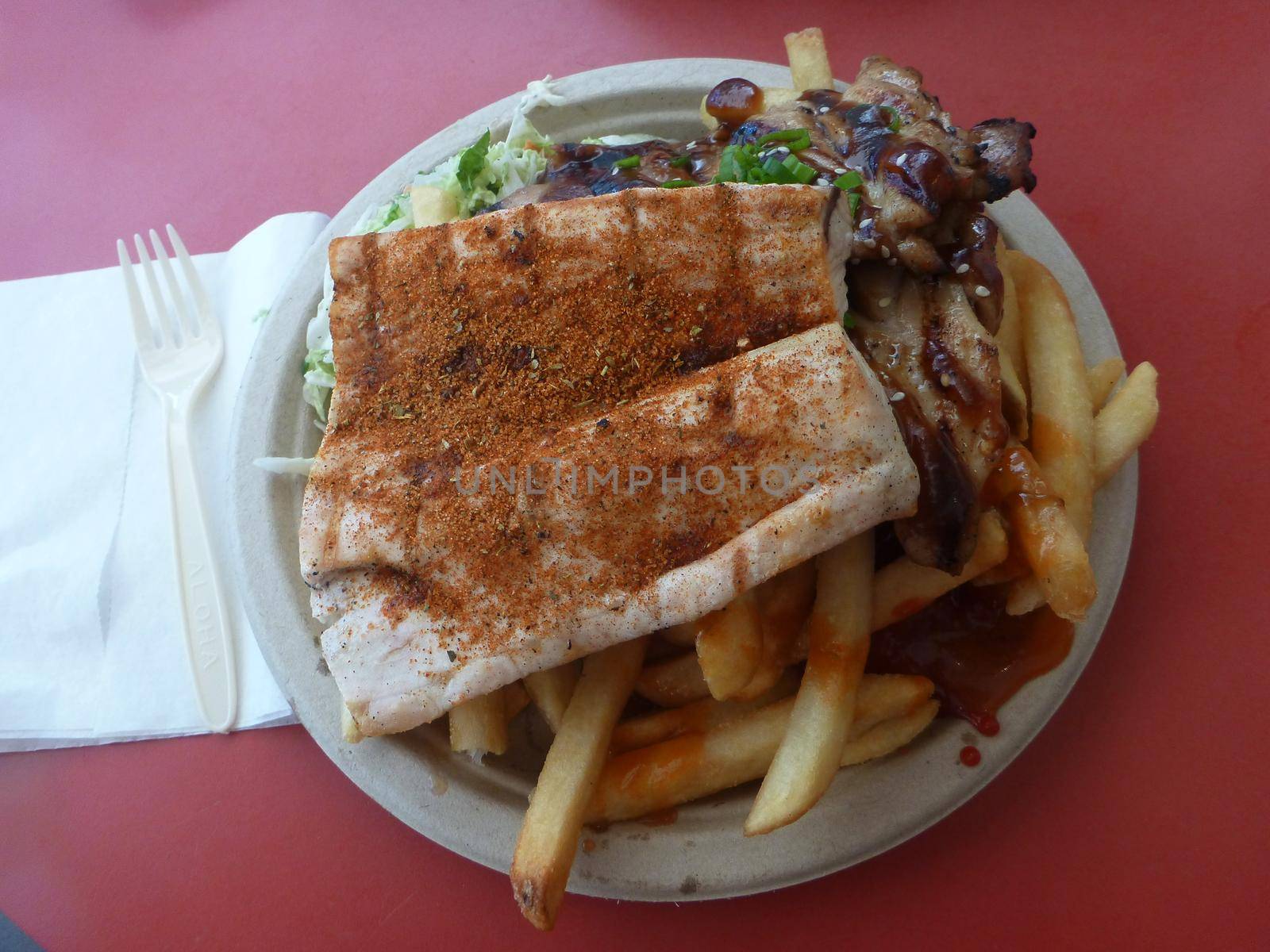 Mauka - Makai: BBQ Chicken AND Ono with coleslaw and french fries on a paper plate with plastic fork and knife.