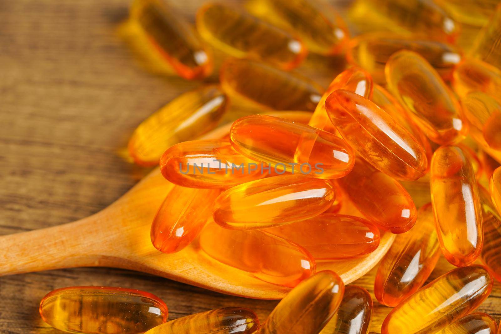 Fish oil or Cod liver oil gel in capsules with omega 3 vitamins, supplementary healthy food 