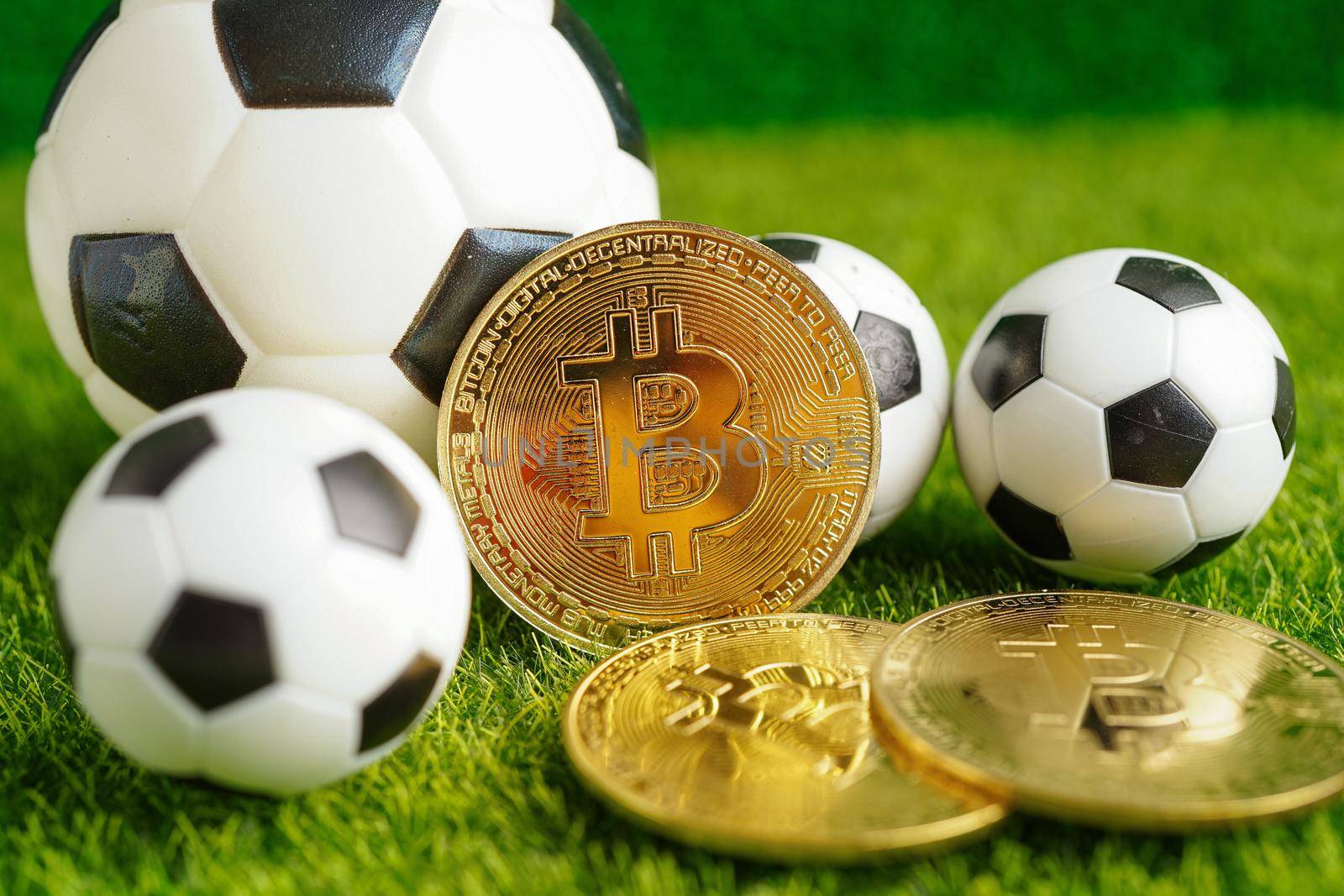 Gold bitcoin with soccer ball or football, cryptocurrency used in online sports betting.