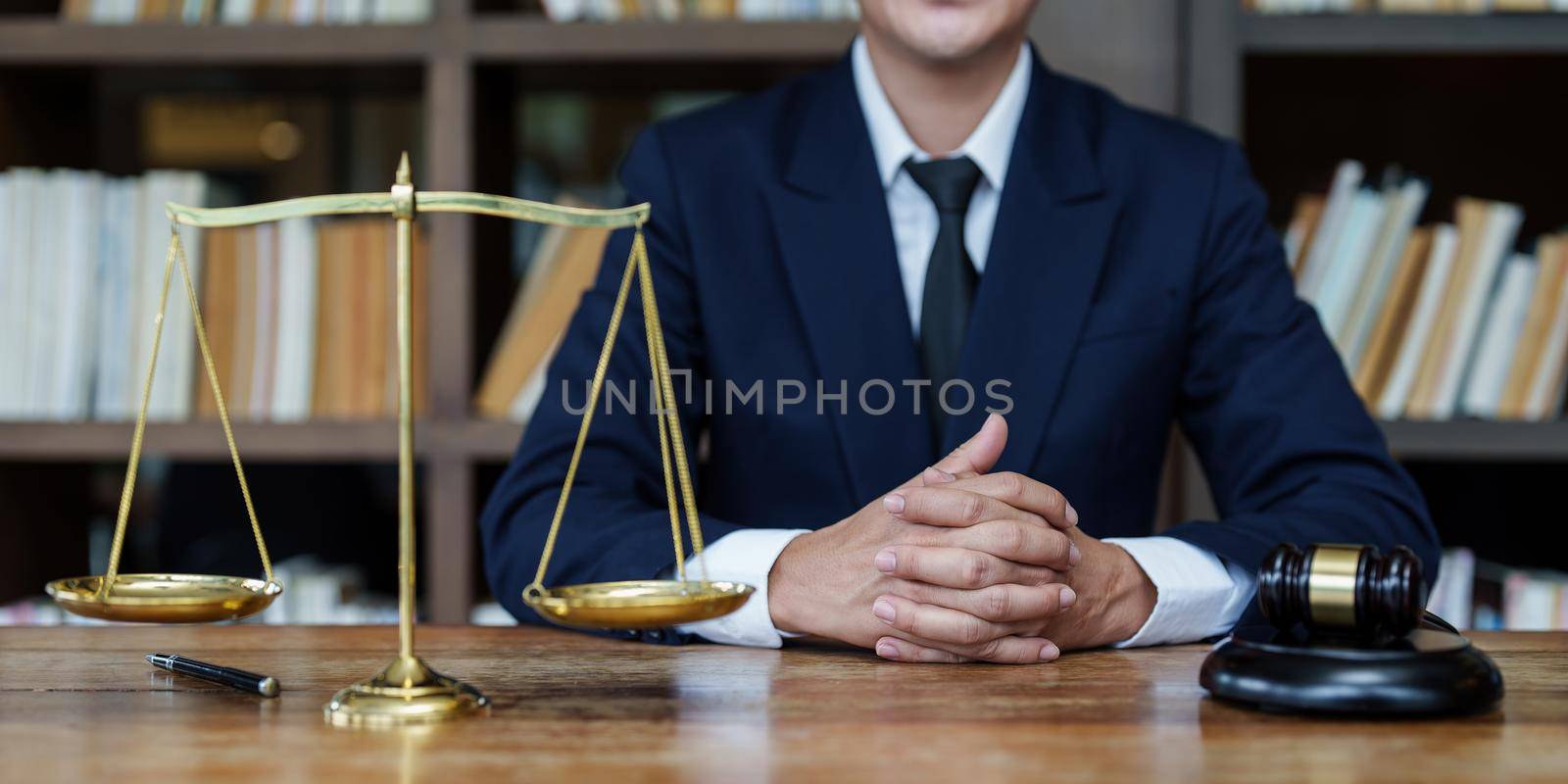 Close up lawyer businessman working or reading lawbook in office workplace for consultant lawyer concept