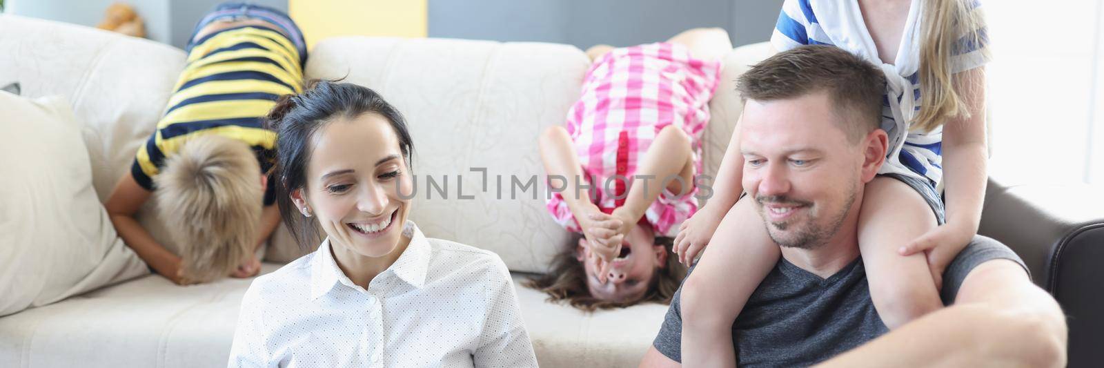 Portrait of happy family spend weekend morning together at home. Father mother and children laugh and have fun. Family, childhood, parenthood, joy concept