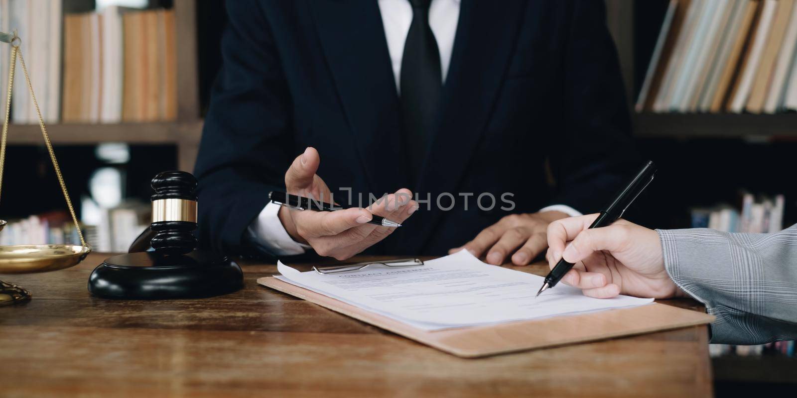 Group of business people and lawyers discussing contract papers ,Consultation between a male lawyer and businessman concept by wichayada