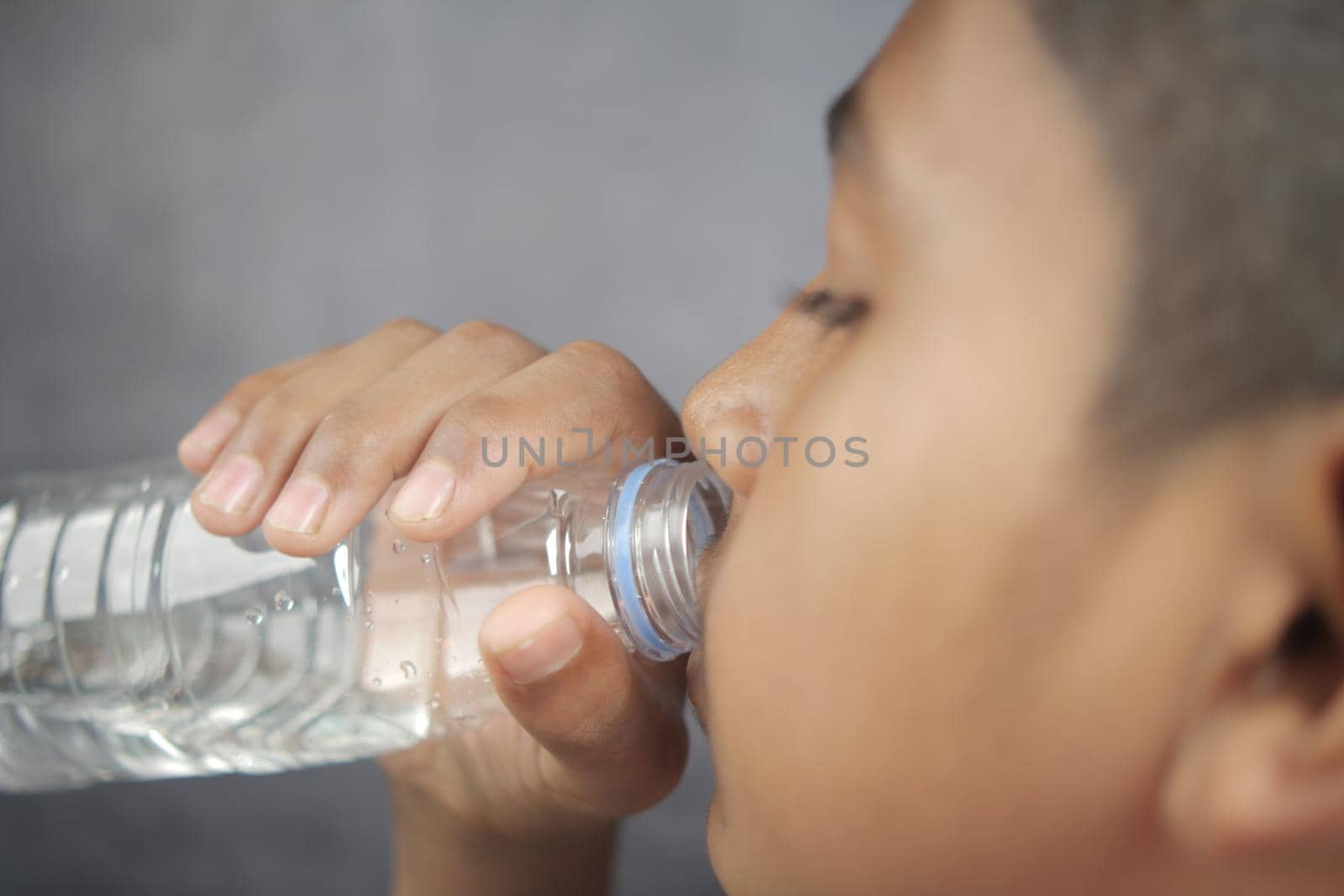teenage boy drinking water slow motion ,