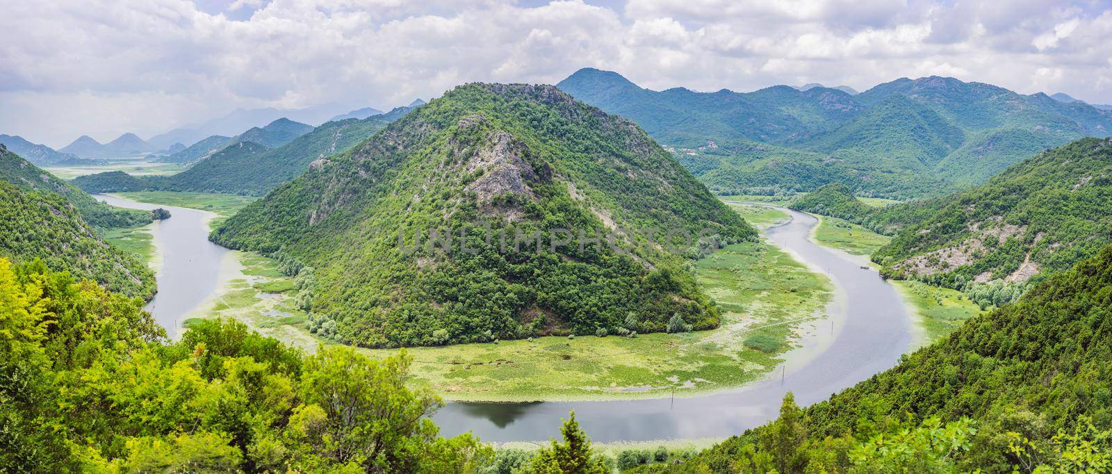 Canyon of Rijeka Crnojevica river near the Skadar lake coast. One of the most famous views of Montenegro. River makes a turn between the mountains and flows backward.