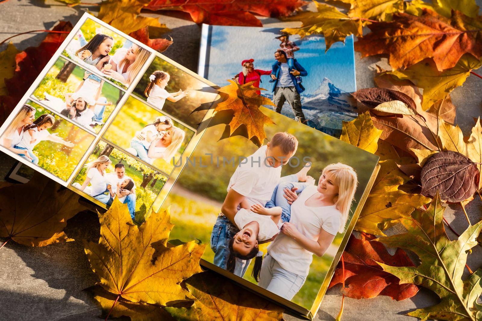 Autumn yellow leaves and family photobook. fall leaves arranged for a photo book background