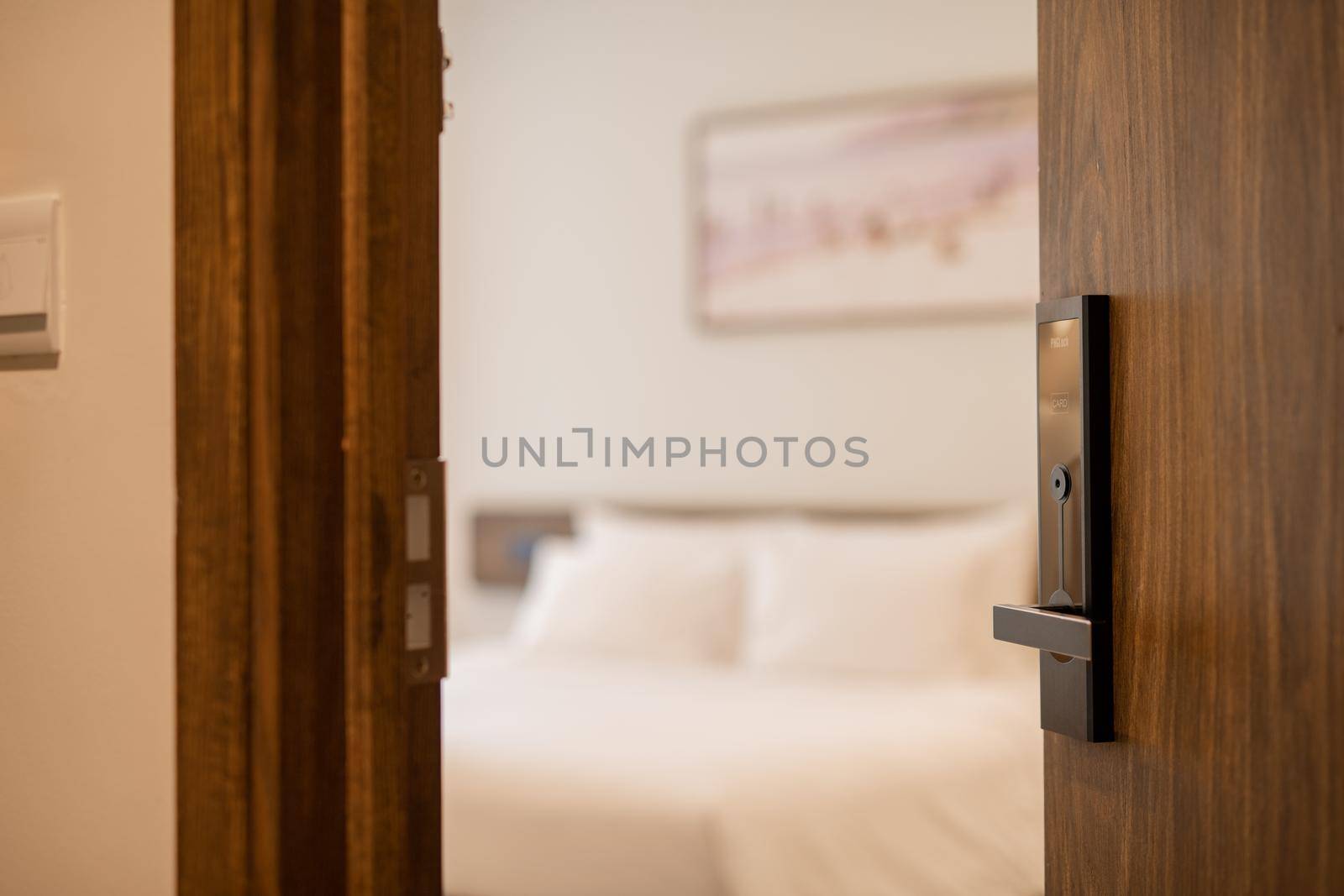 Open the door. Hotel room, Condominium or apartment doorway with open door in front of blur bedroom background