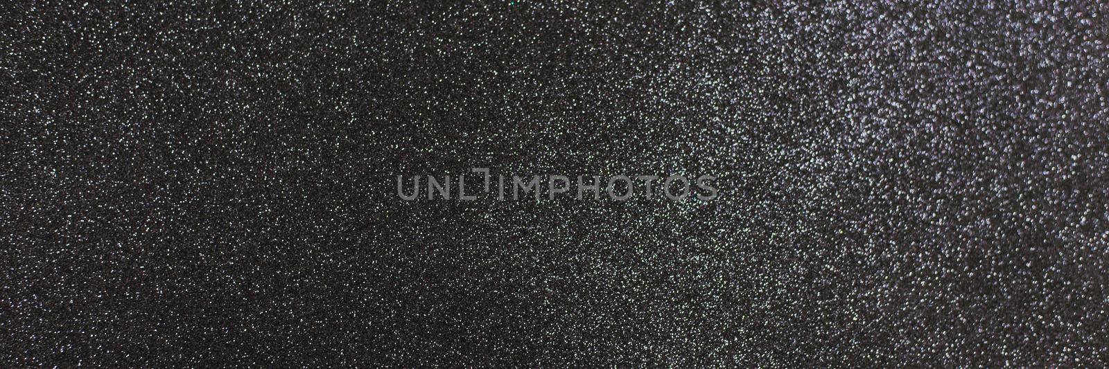 Black shiny background with sparkles. Dark gray abstract festive background. Web banner.