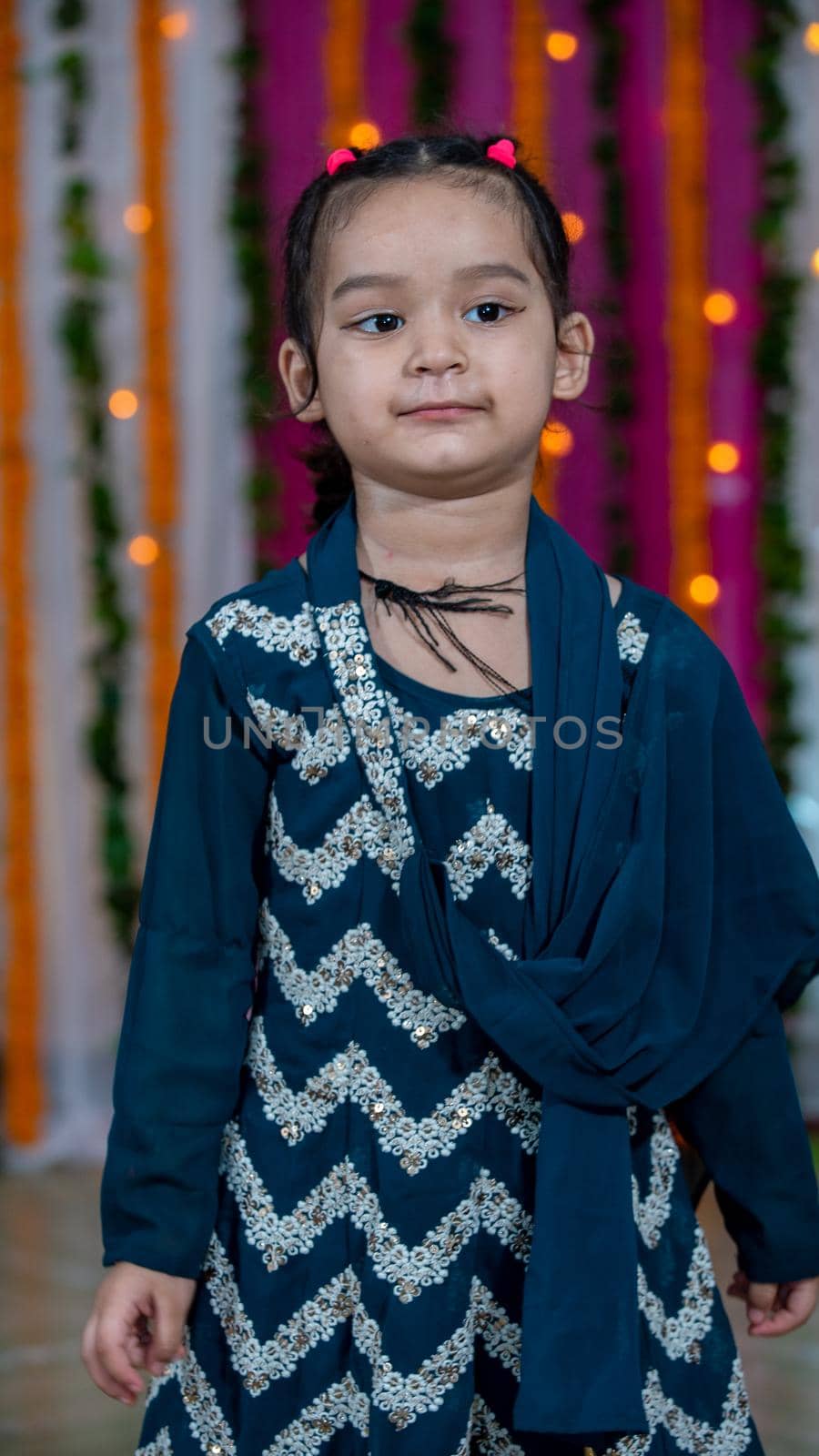 Indian children wearing ethnic Indian dress during Raksha Bandhan, a festival to celebrate the bond between brother-sister. Decoration in Indian houses.