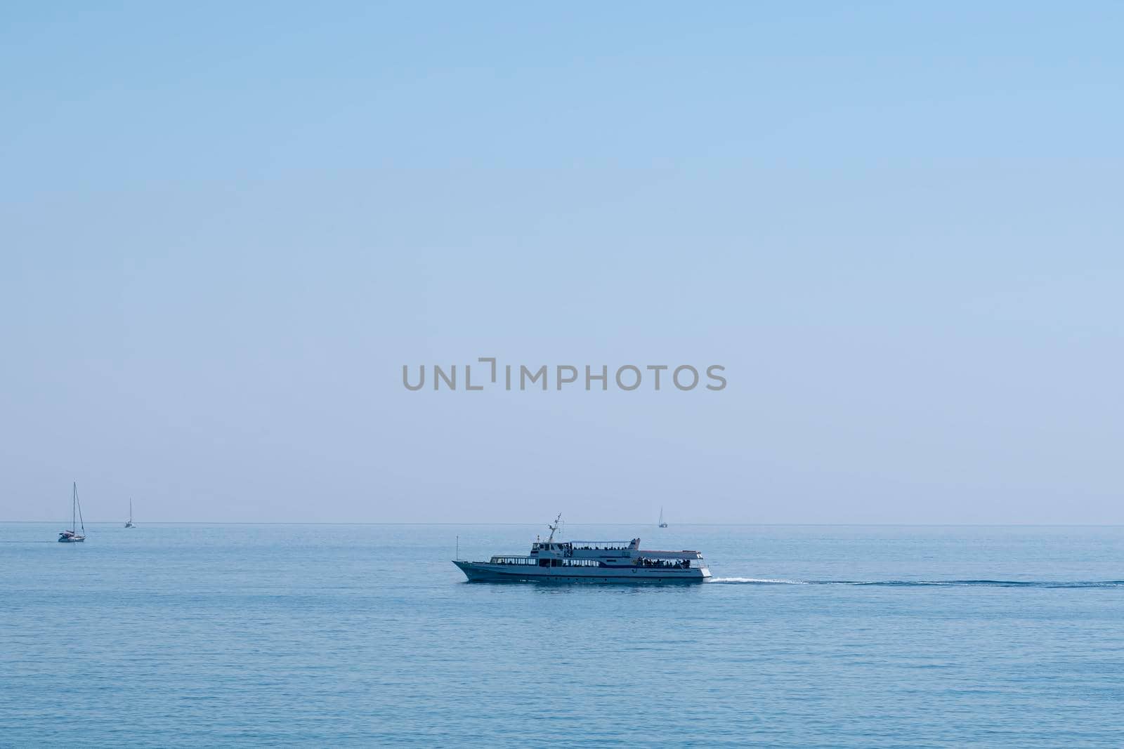 the ship is moving along the horizon of the sea. High quality 4k footage