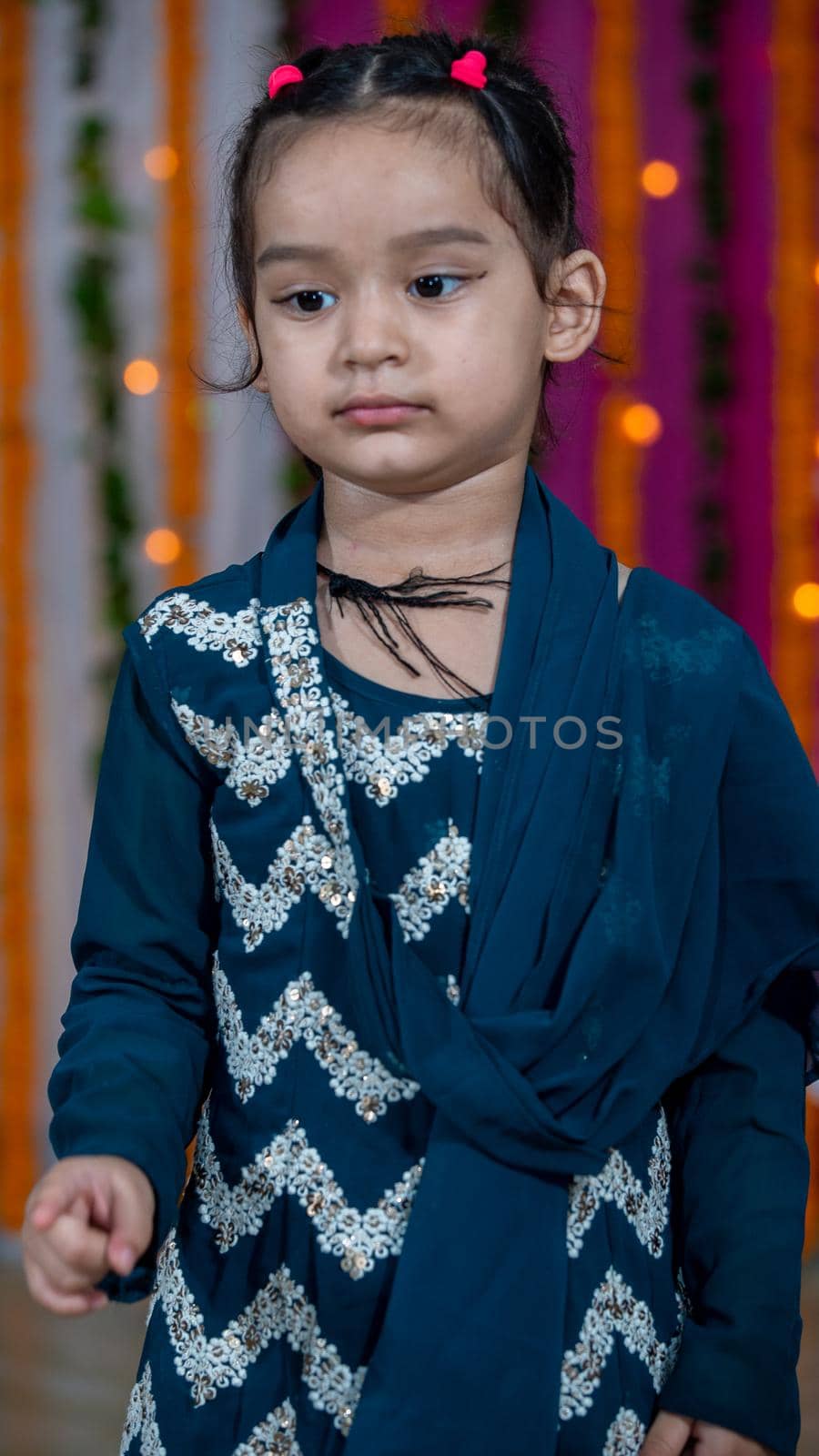 Indian children wearing ethnic Indian dress during Raksha Bandhan, a festival to celebrate the bond between brother-sister. Decoration in Indian houses.