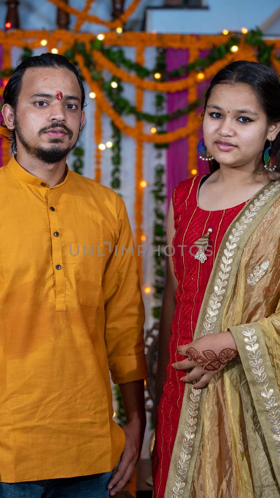 Indian children wearing ethnic Indian dress during Raksha Bandhan, a festival to celebrate the bond between brother-sister. Decoration in Indian houses.