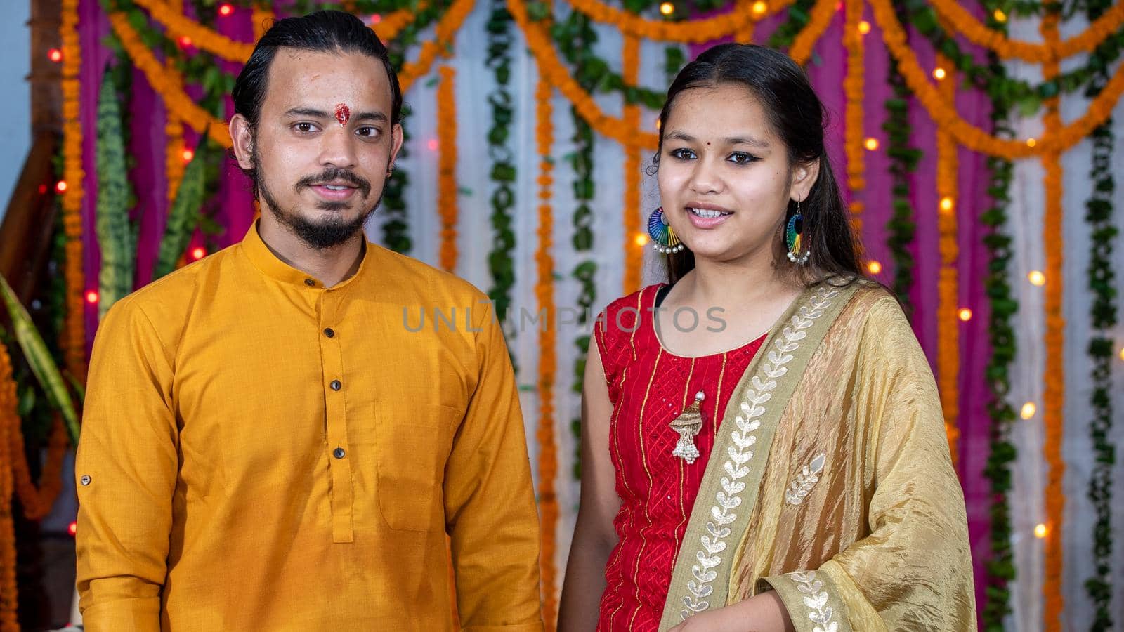 Indian children wearing ethnic Indian dress during Raksha Bandhan, a festival to celebrate the bond between brother-sister. Decoration in Indian houses.