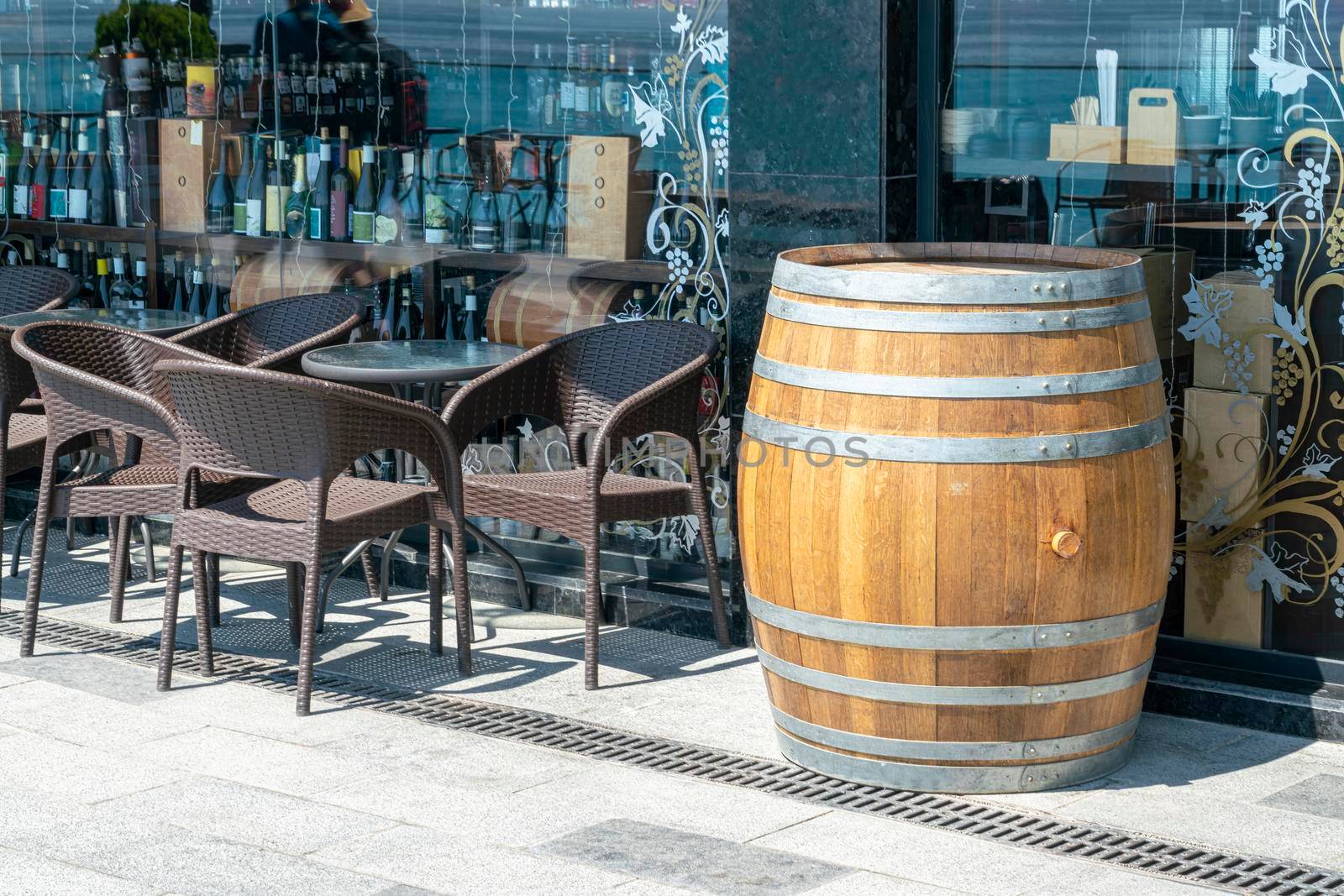 cafe tables with an oak wine barrel. High quality photo