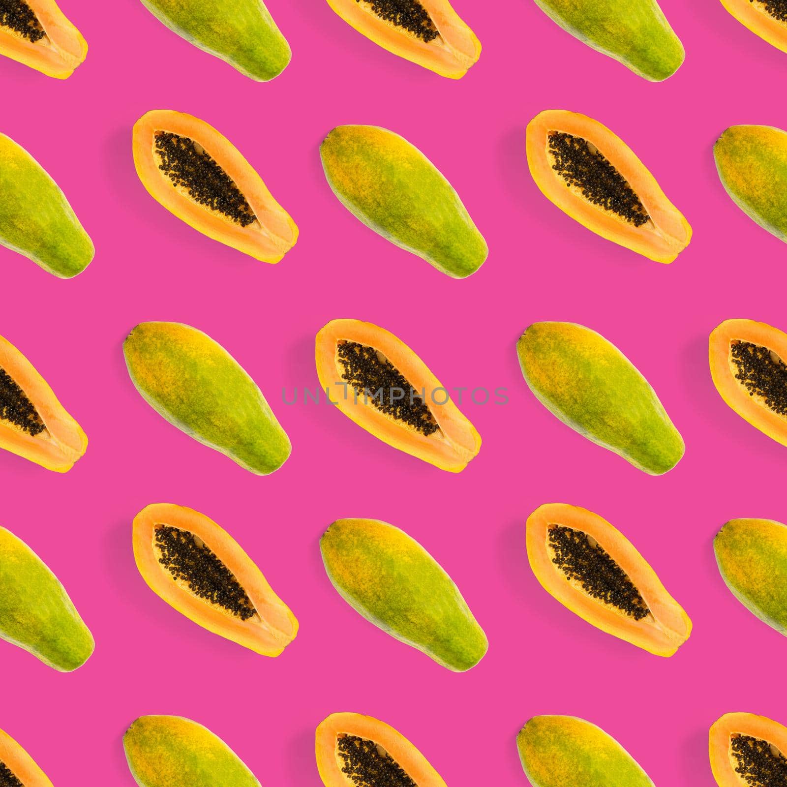 Fresh ripe papaya seamless pattern on pink background. Tropical abstract background. Top view. by PhotoTime