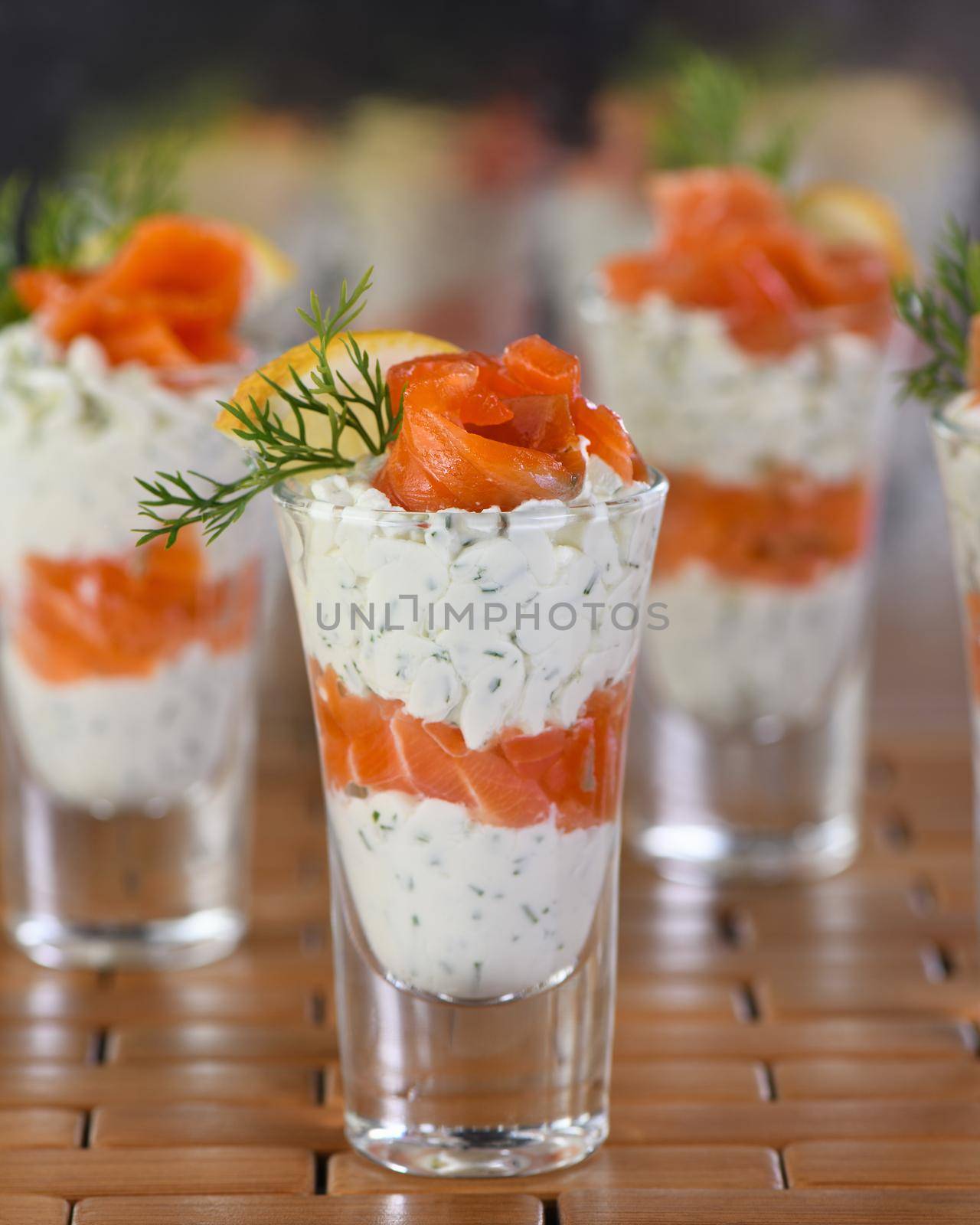 Verrines  from soft cheese cream and salmon, dill sprig and lemon slice. Aperitif appetizer.