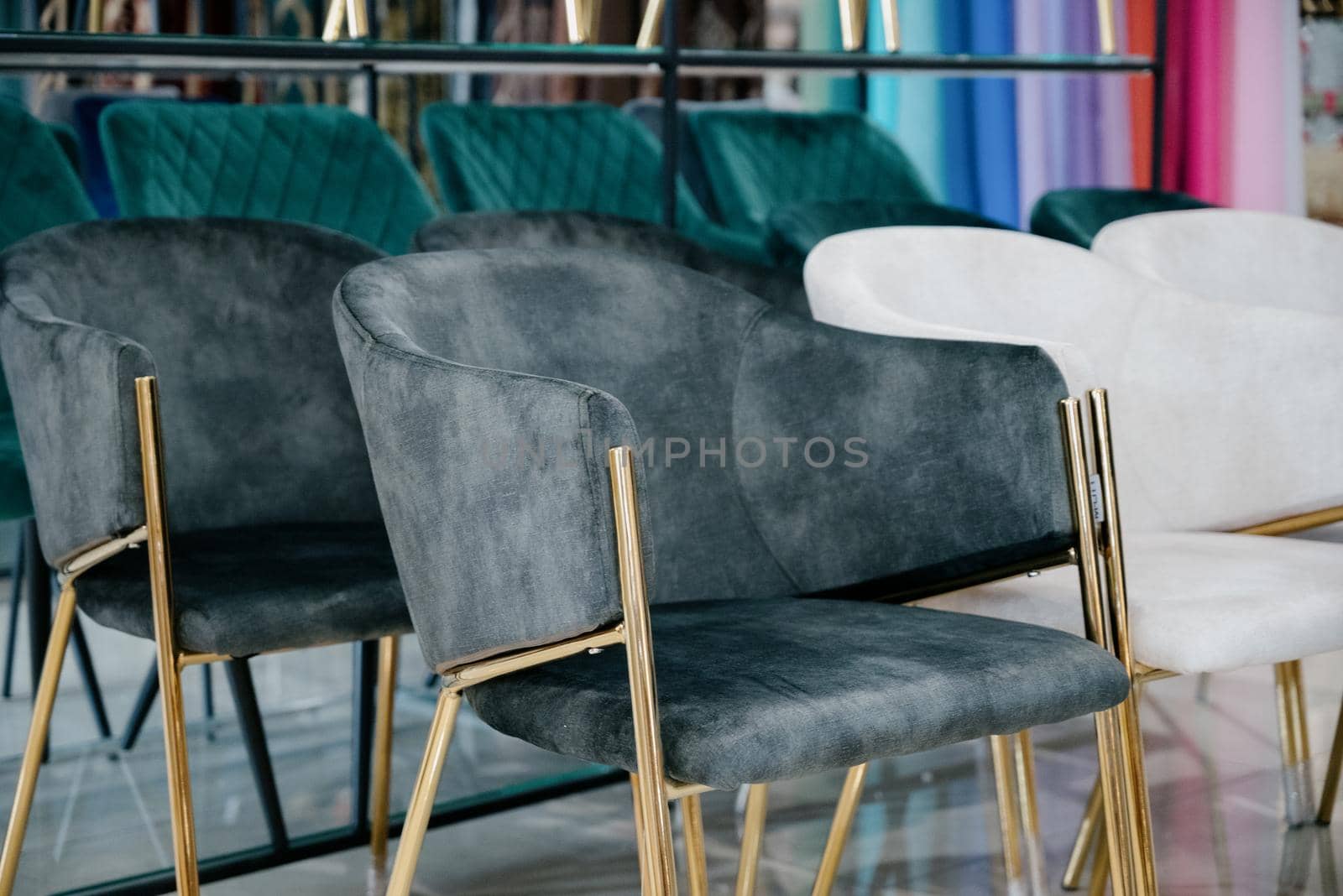 Armchairs in the furniture salon. Showroom, showroom of modern upholstered furniture and armchairs.Furniture store, selection of armchairs