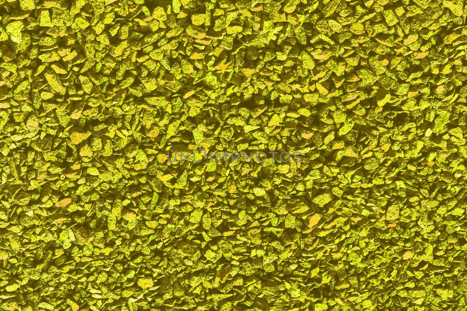 Golden yellow background of small stones for decor and text by jovani68