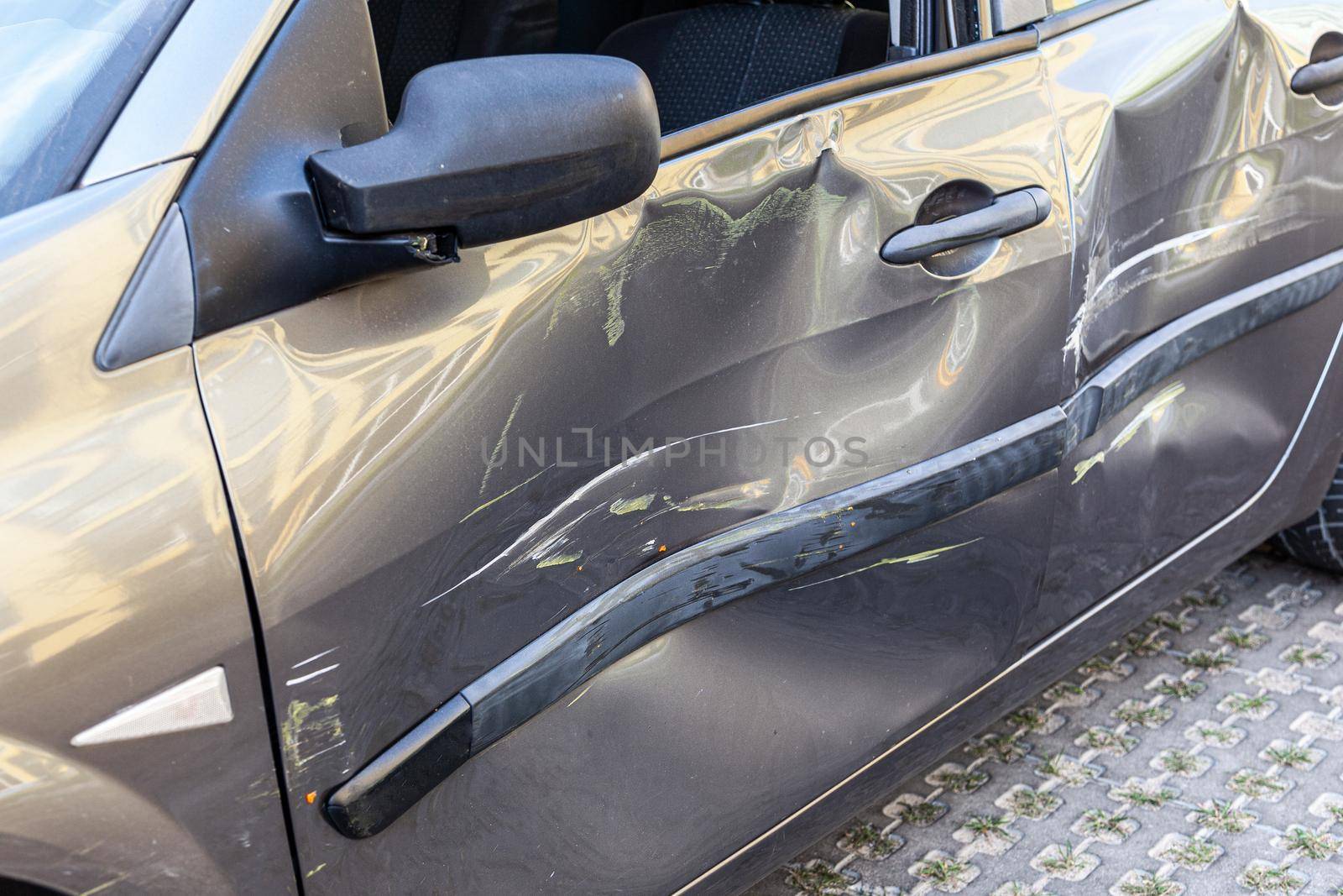 Damaged car with a scratches and dent on door, dints on auto after an road accident, by Khosro1