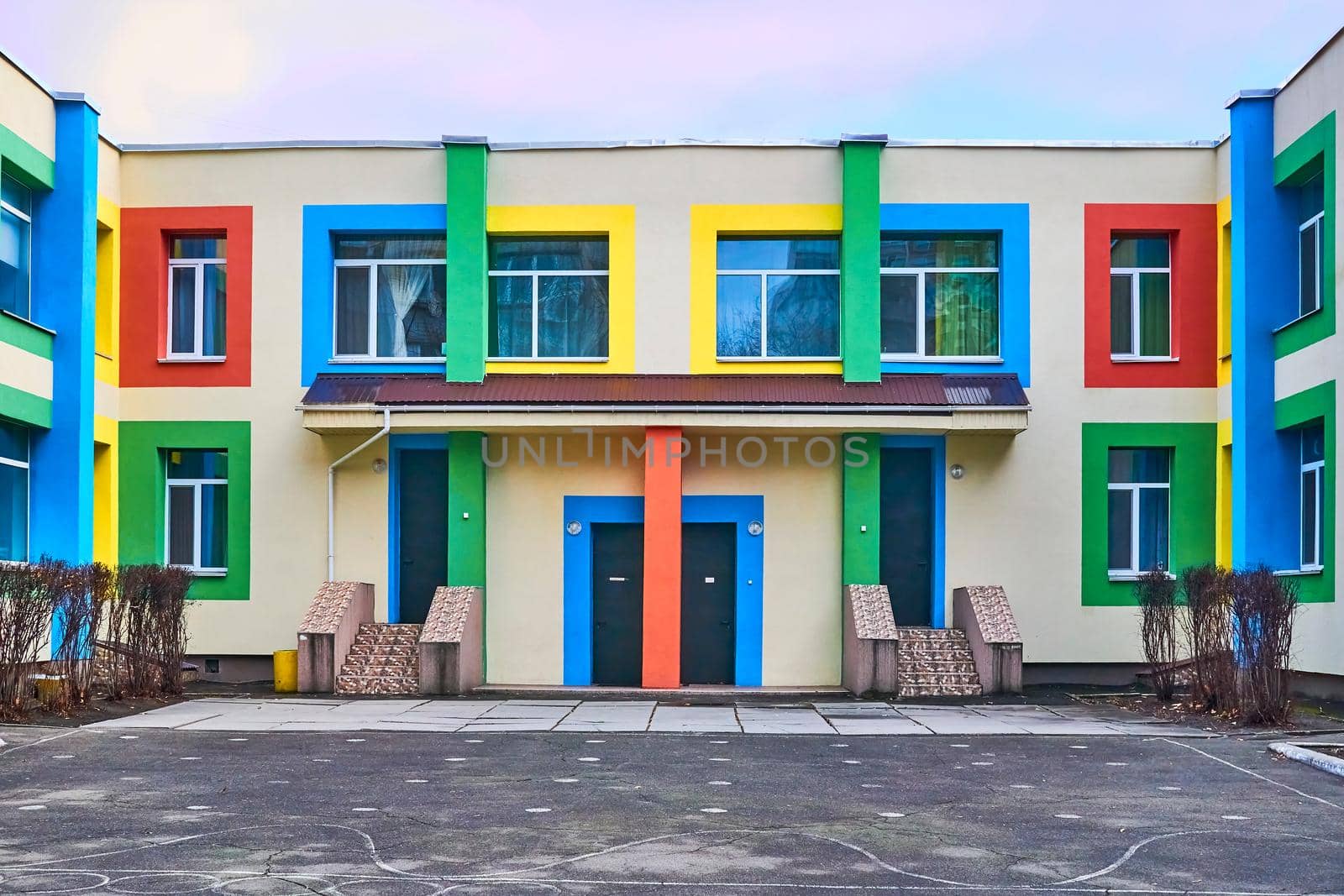 The bright multi-colored building of the kindergarten school by jovani68