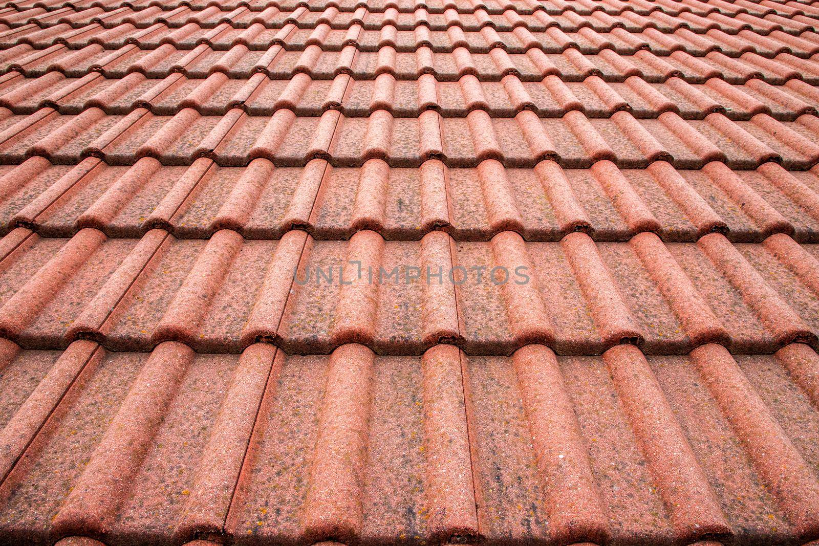 New roof with ceramic tiles close-up. Roofing tiles