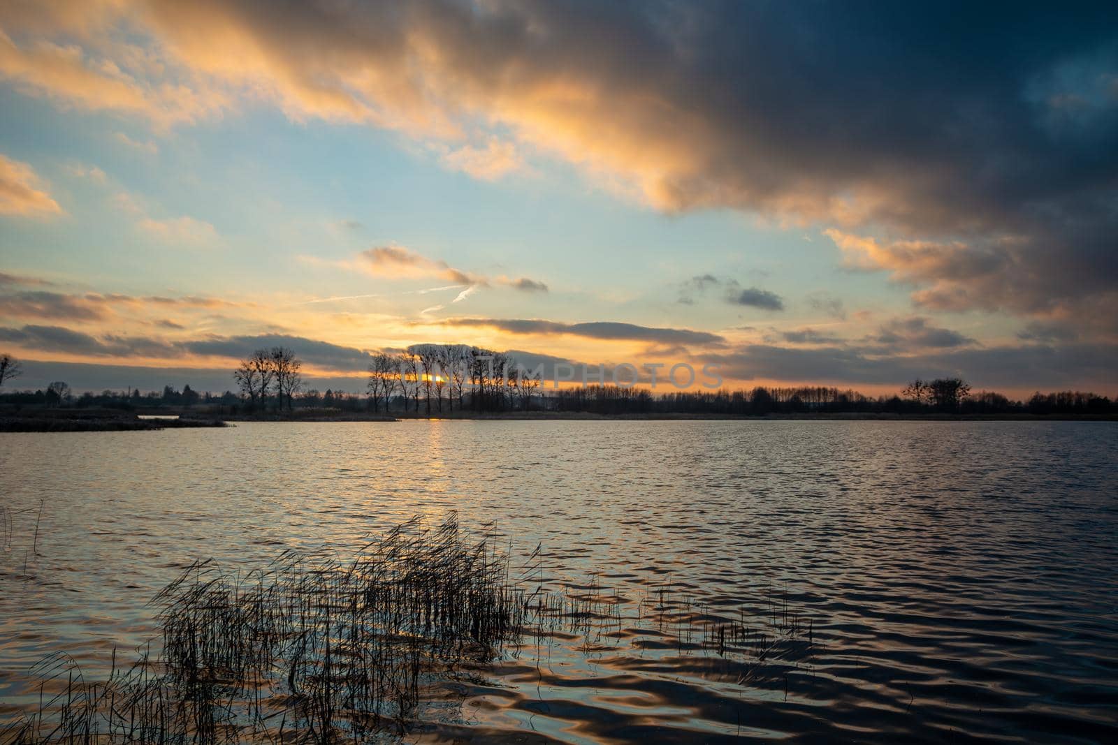 Moody view of a sunset over a lake, Stankow, Poland