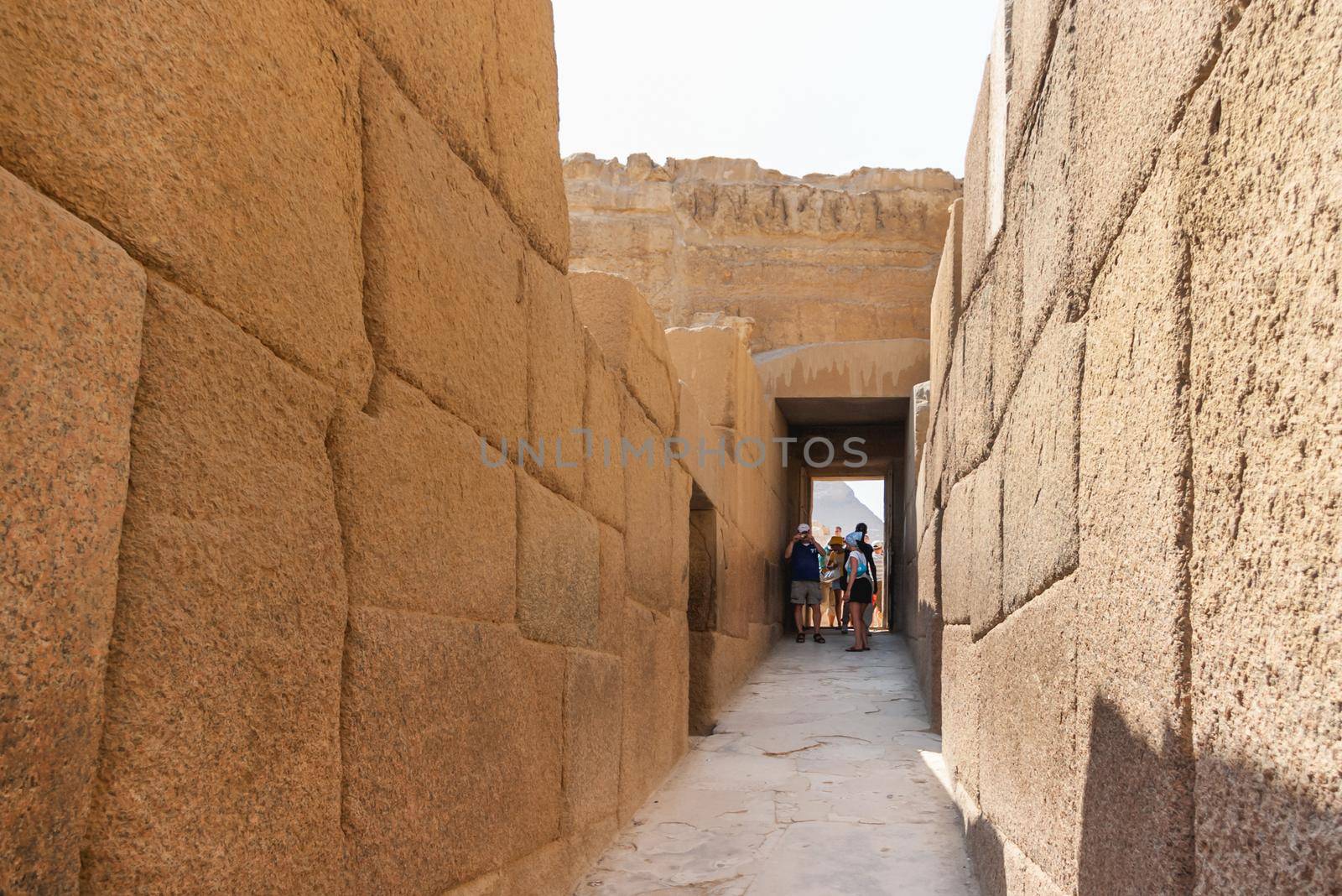 CAIRO, EGYPT - September 11, 2008. Tourists walk in corridor near the Great Pyramid of Giza and Sphinx. Architectural landmark in Africa.