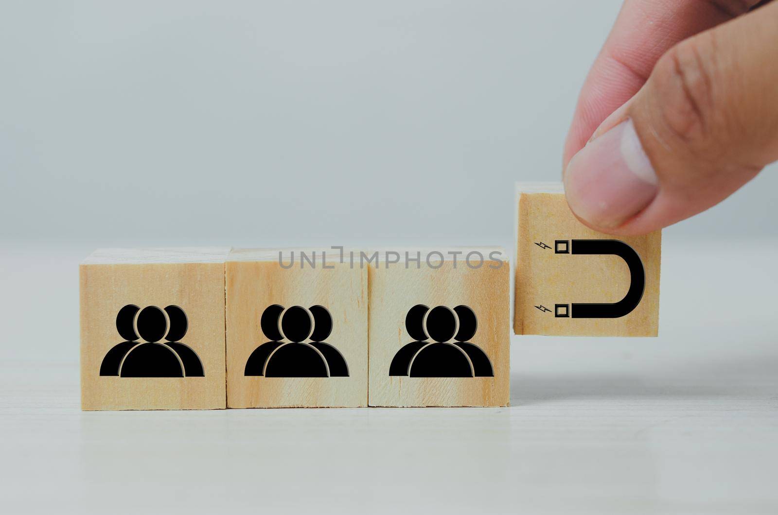 Wooden cube with people and magnet icons.Digital Marketing Inbound marketing concept.