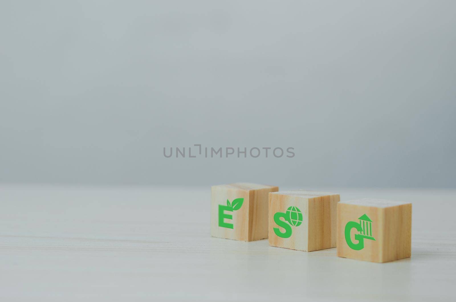 Wooden cubes with ESG Environmental Social Governance symbol on background and copy space.Business concepts.