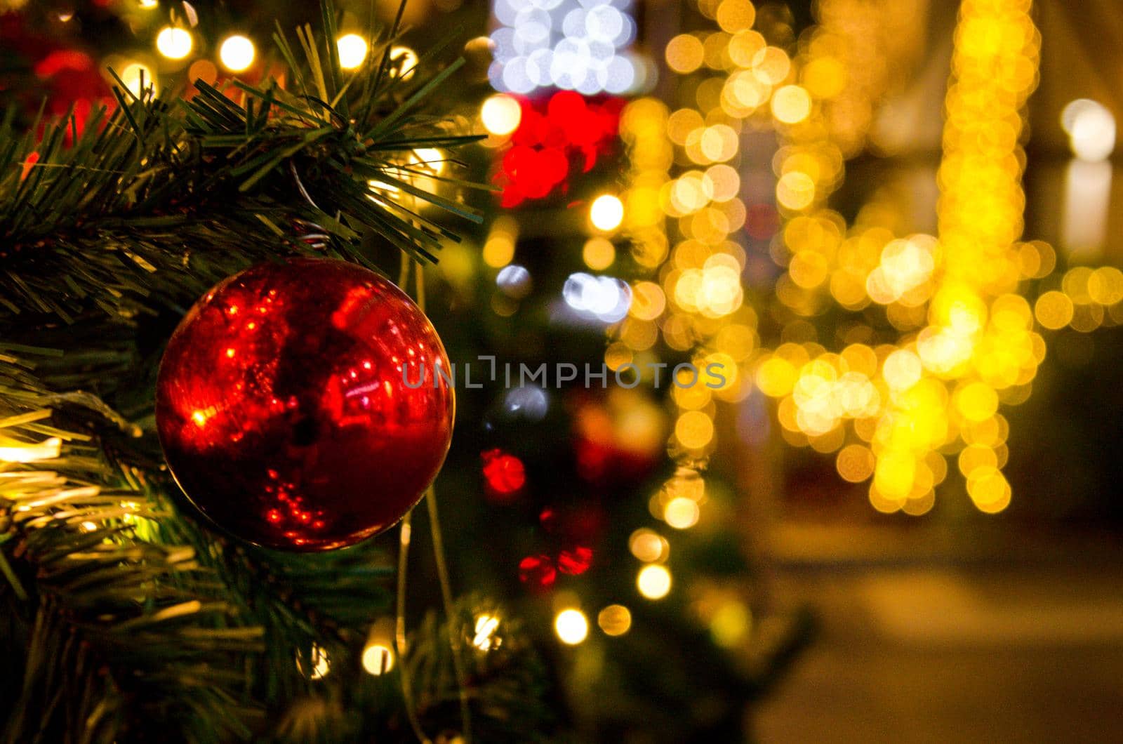 Red balls decorated with Christmas tree decorations. New year and Christmas festivals. Copy space background.