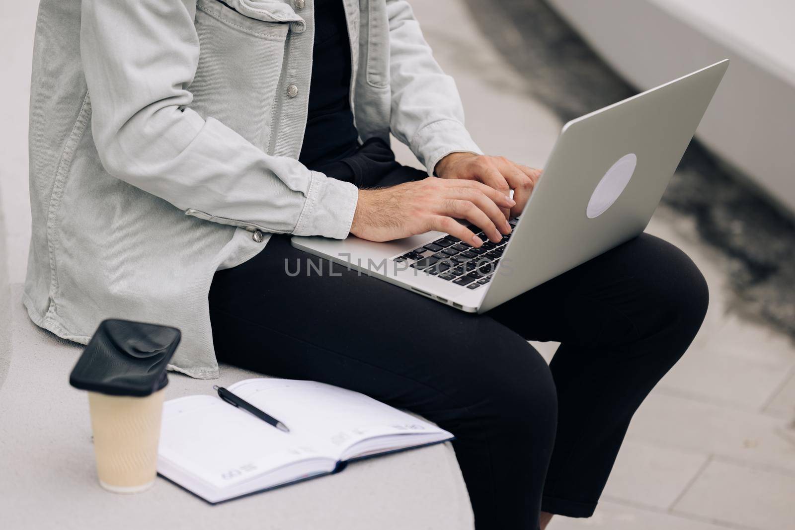 Close up of male hands of business man professional user worker using typing on laptop notebook keyboard sit near office working online with pc software apps technology concept by uflypro