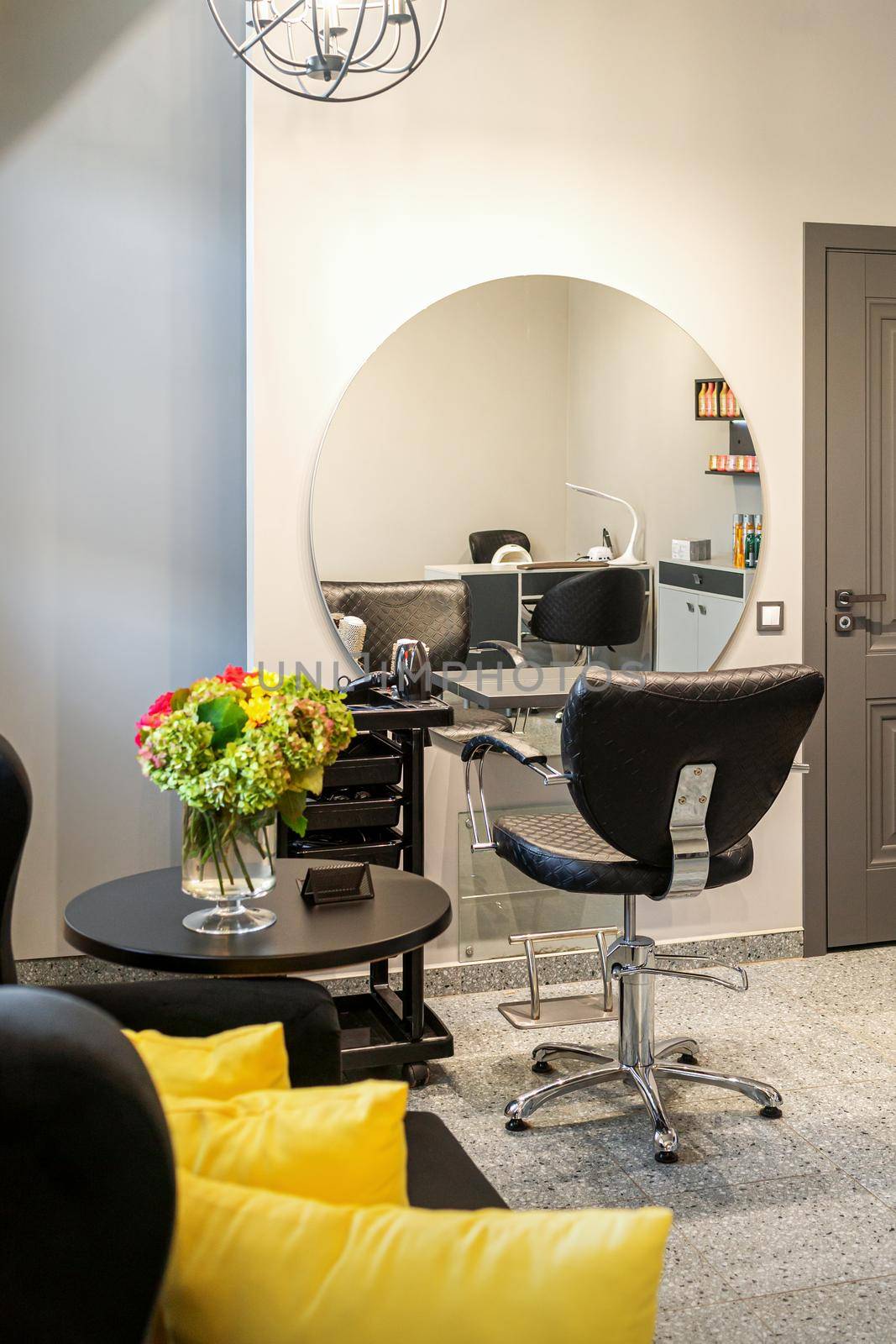 Interior of empty modern hair and beauty salon in lights tones