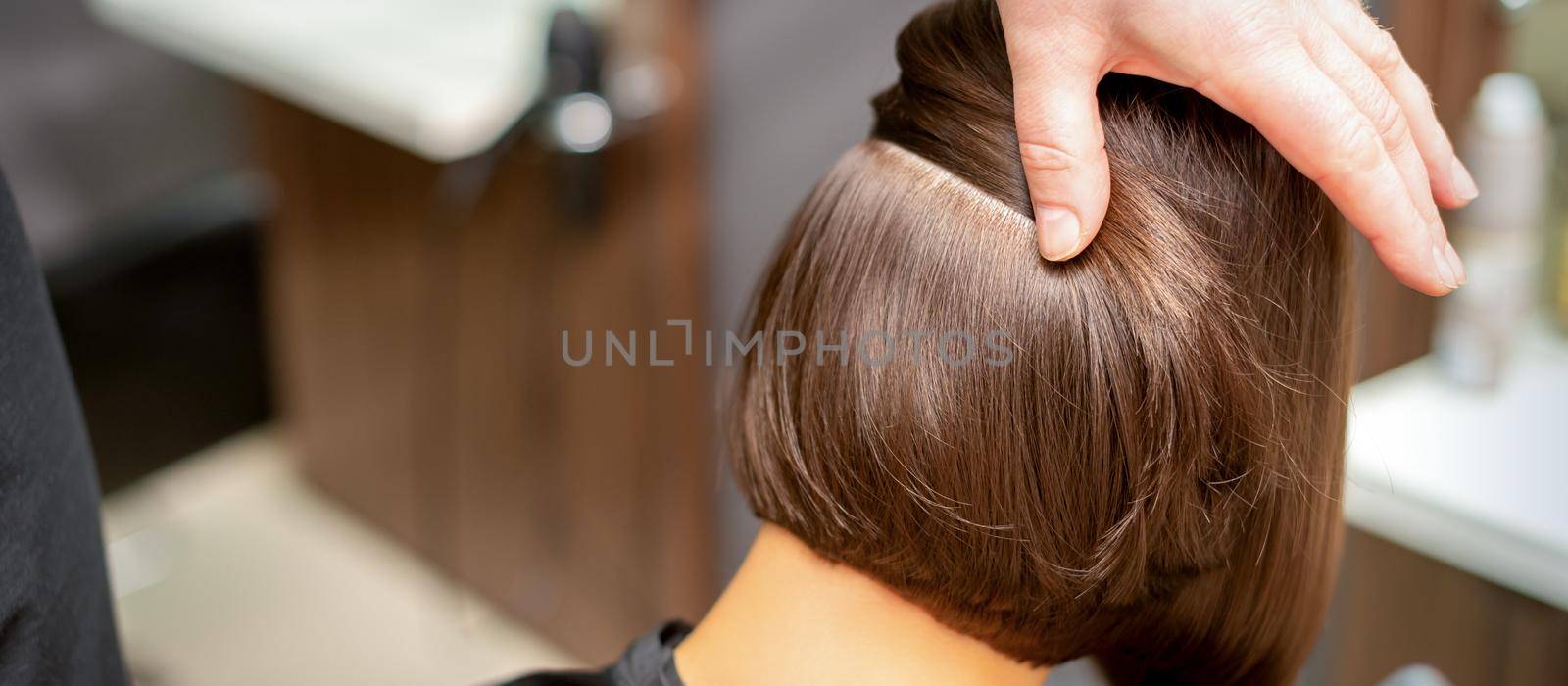 Hairdresser checks short brown hairstyle by okskukuruza