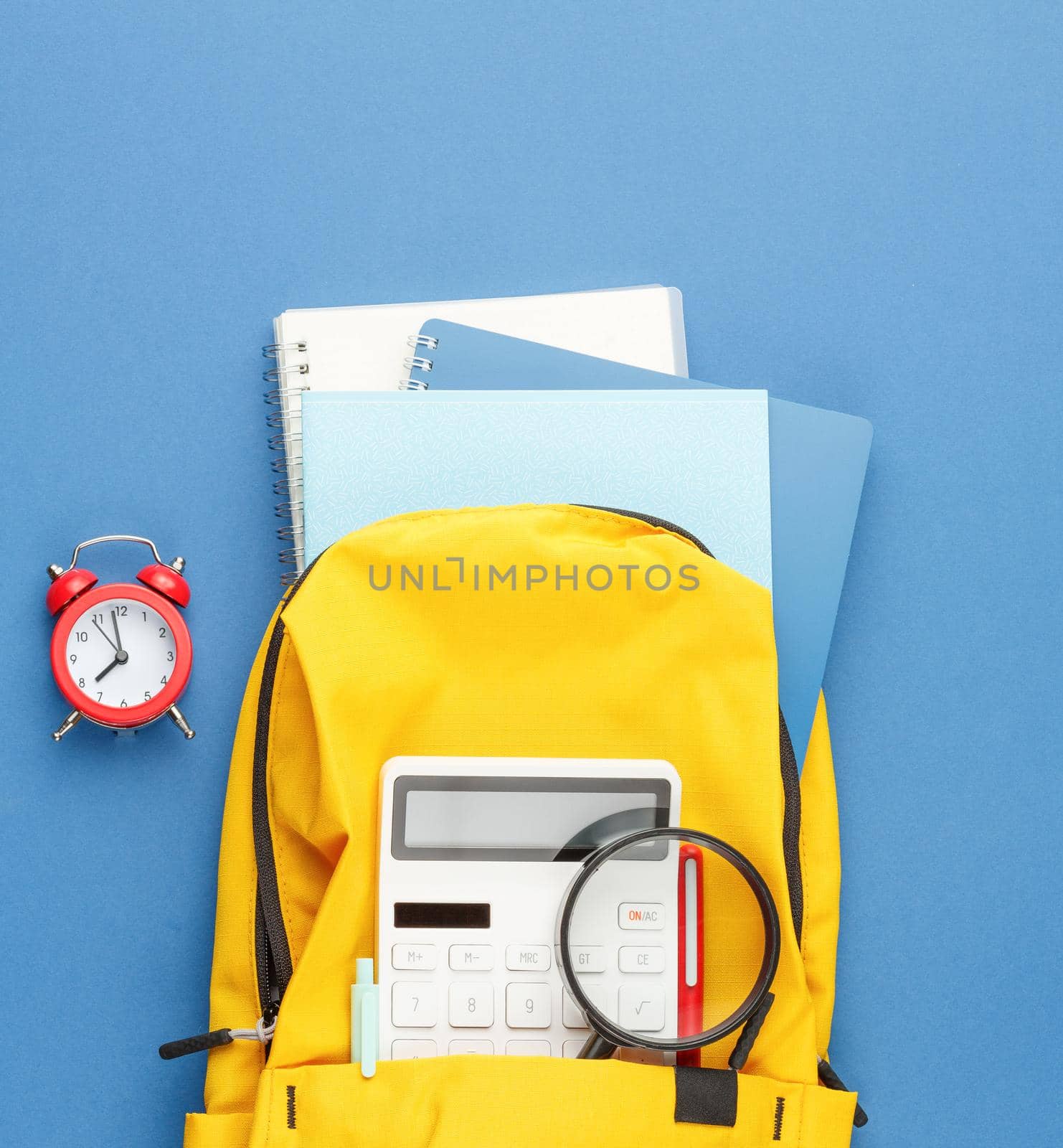 Back to school concept. Backpack with school supplies. Flat lay.